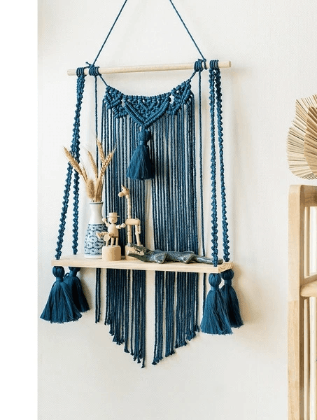 Handcrafted macrame hanging shelf with tassels for wall décor