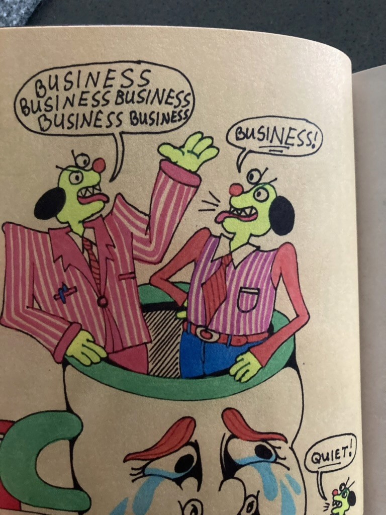 A green butterfly rests on a flower.