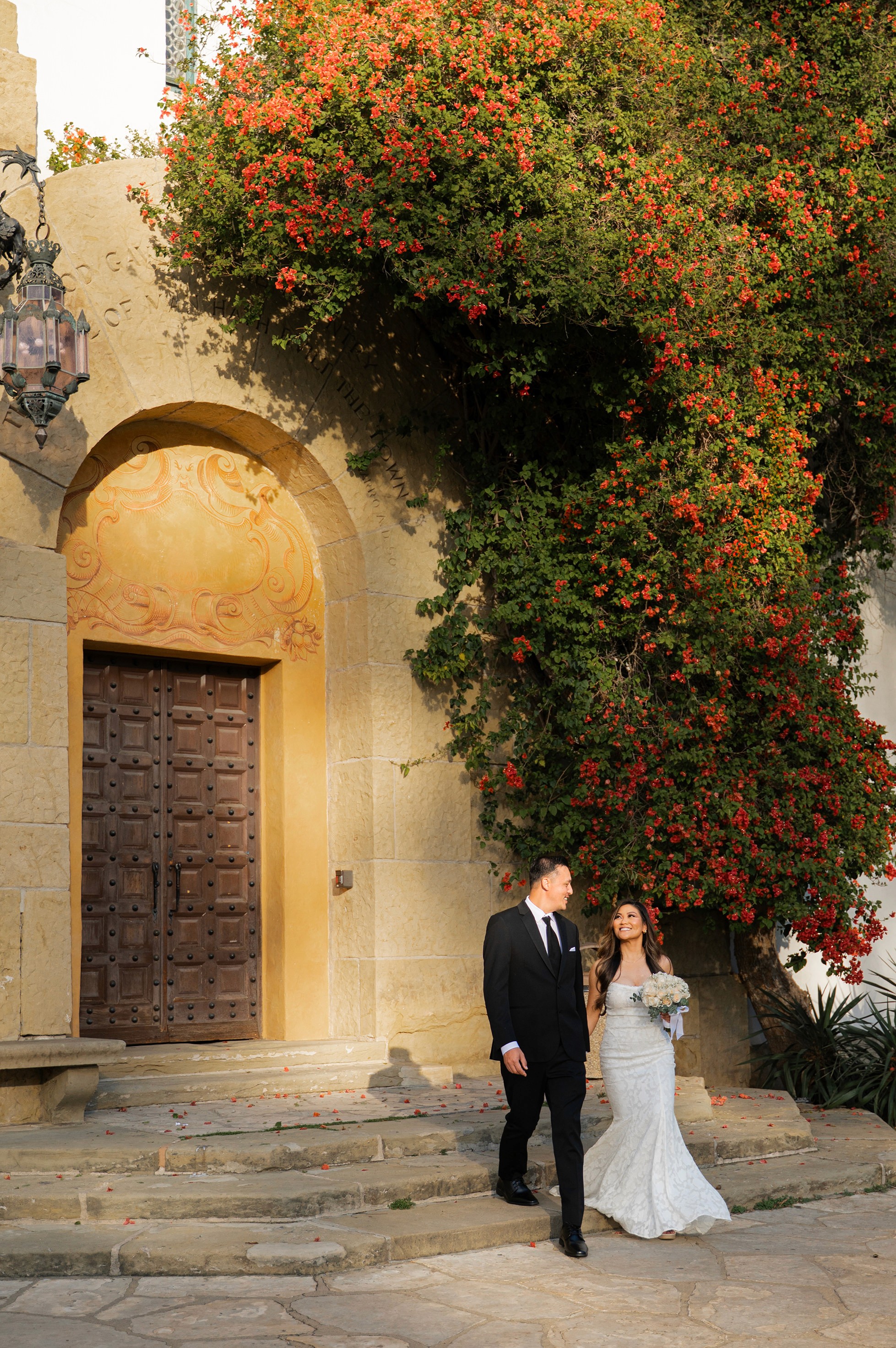 Just married couple walking at Santa Barbara Courthouse elopement session