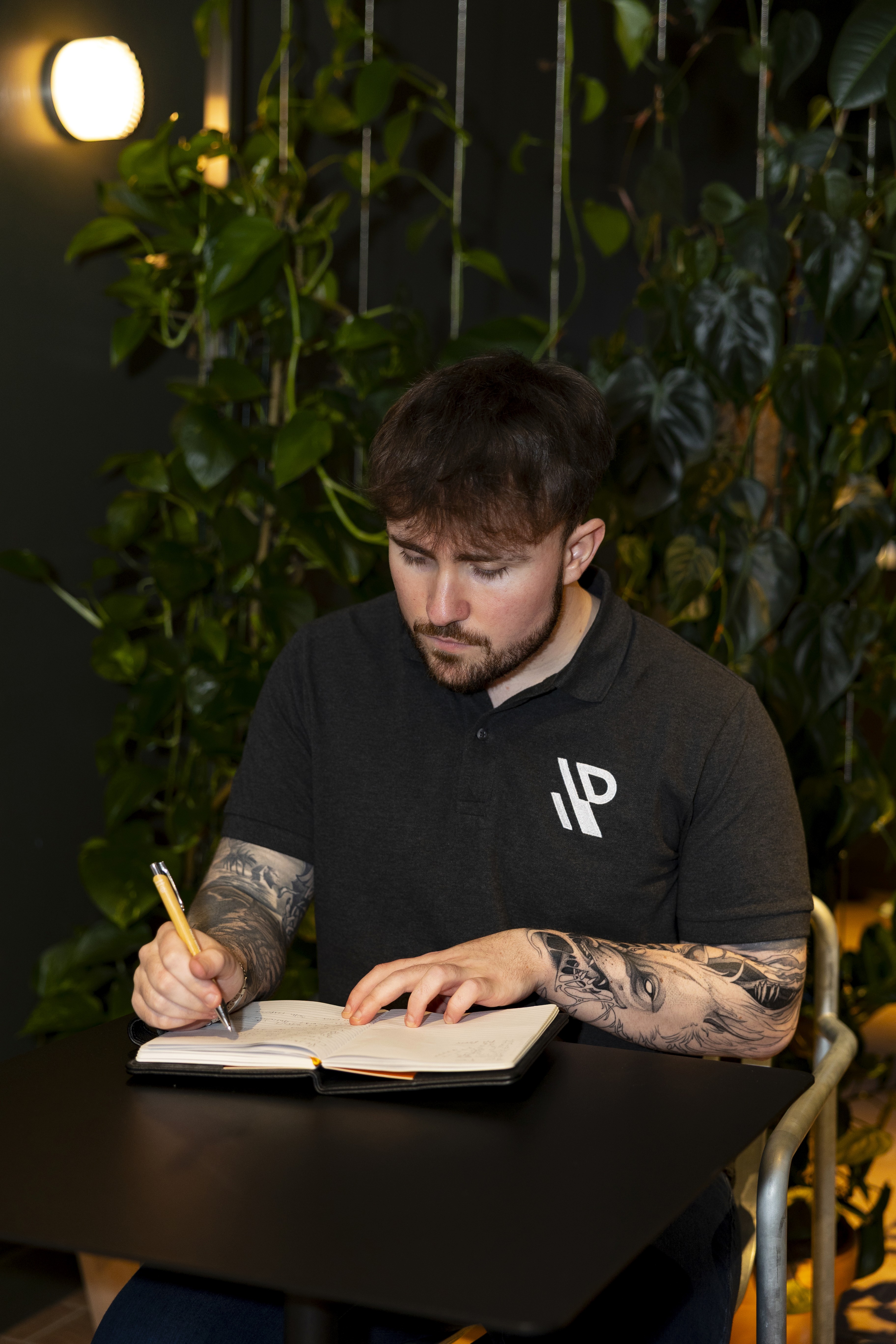 Jamie writing in a book