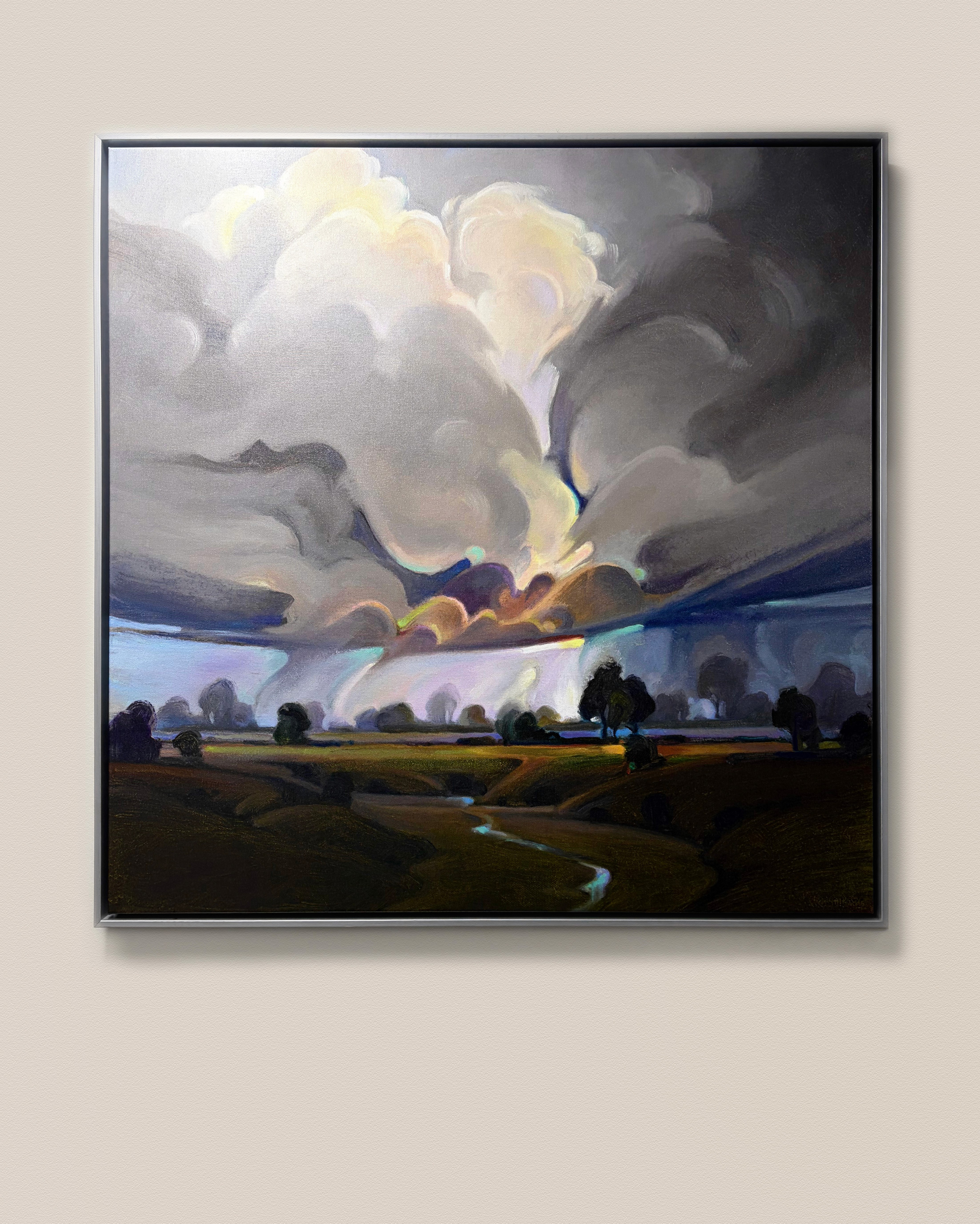 Modern indoor space with large glass doors, lush greenery, and a cozy seating area visible beyond.