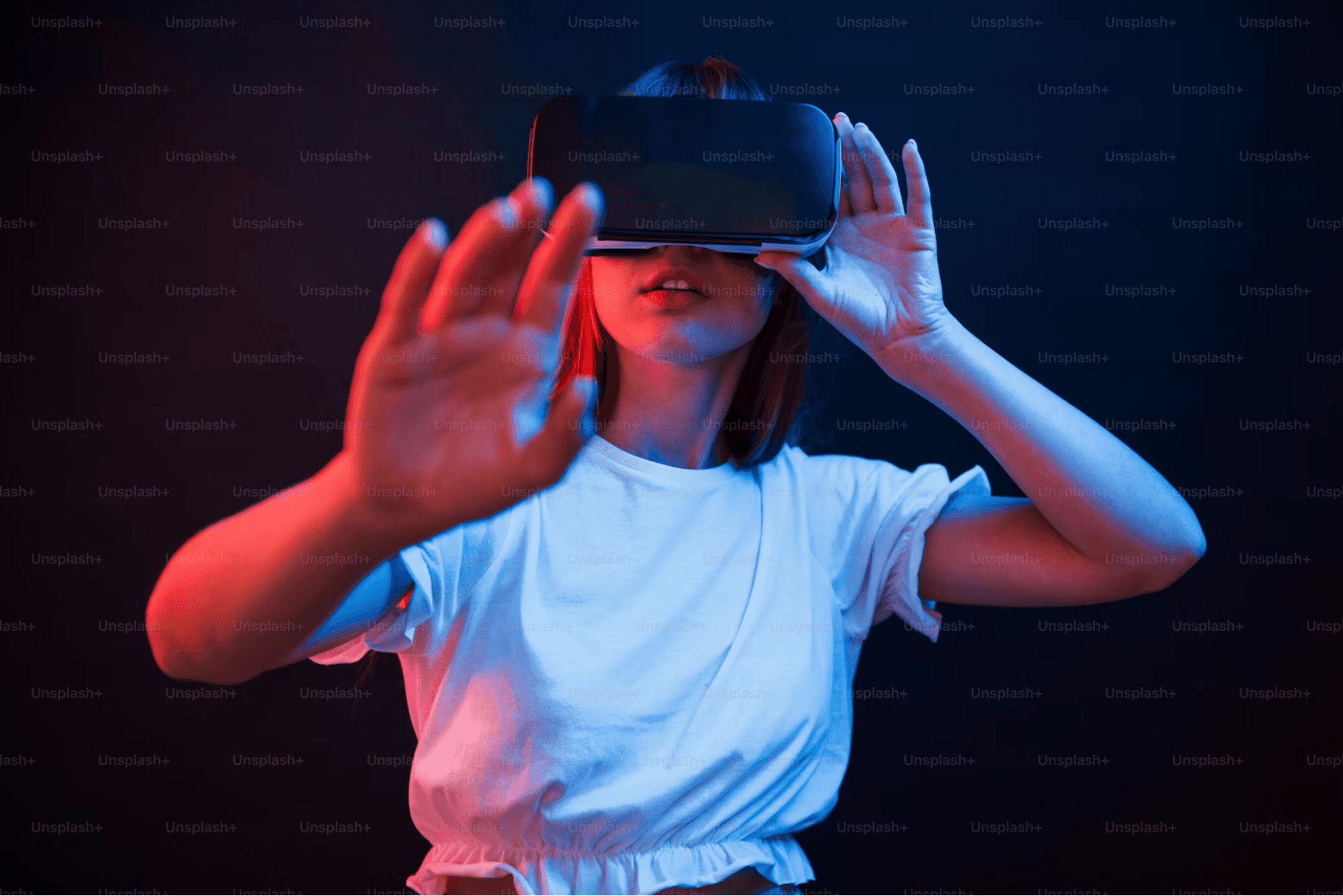  A woman wearing a VR to navigate the Metaverse. 