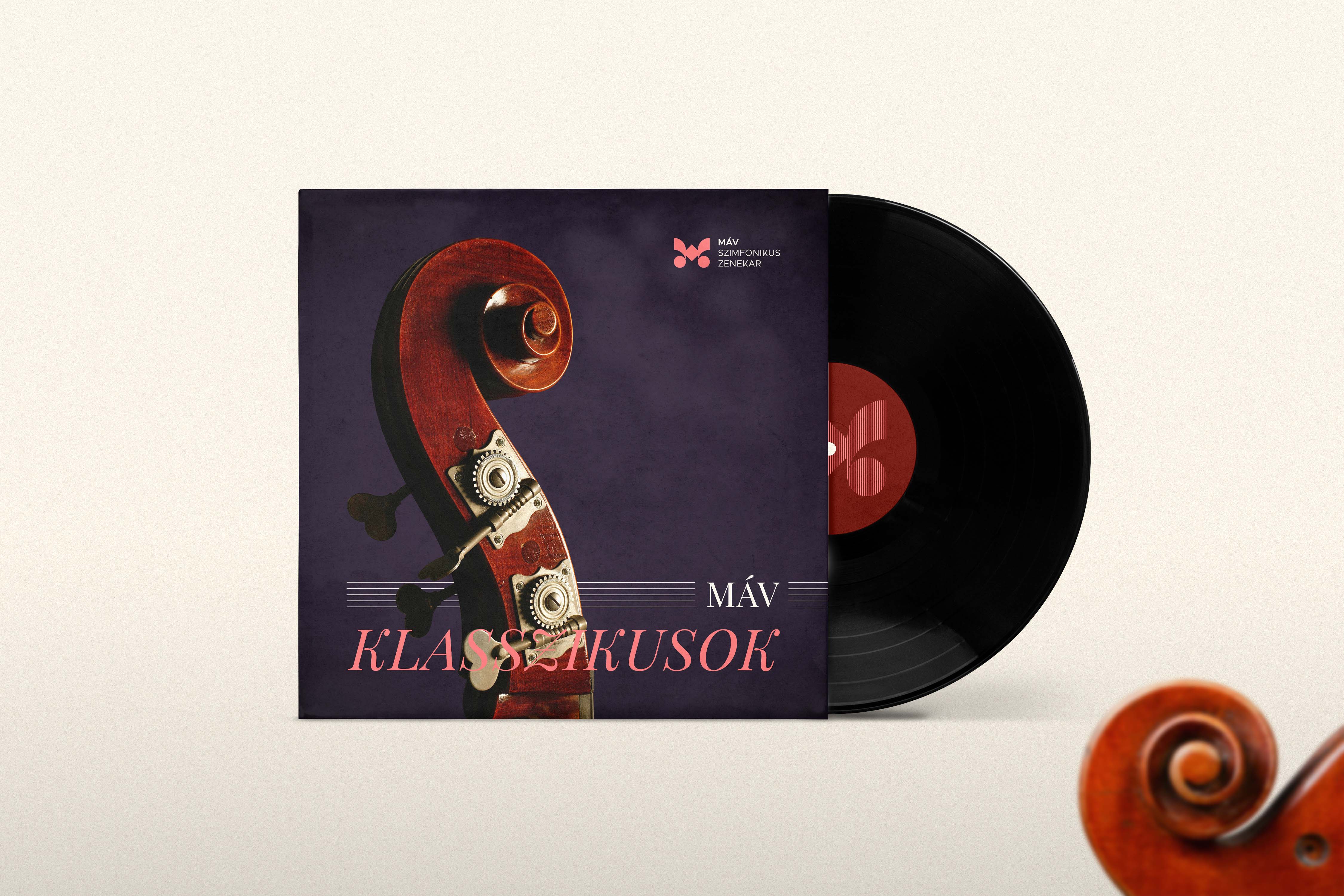 Vinyl record cover design with scroll close-up and V2 logo on the label - MÁV Symphony Orchestra, a symphony orchestra brand identity.