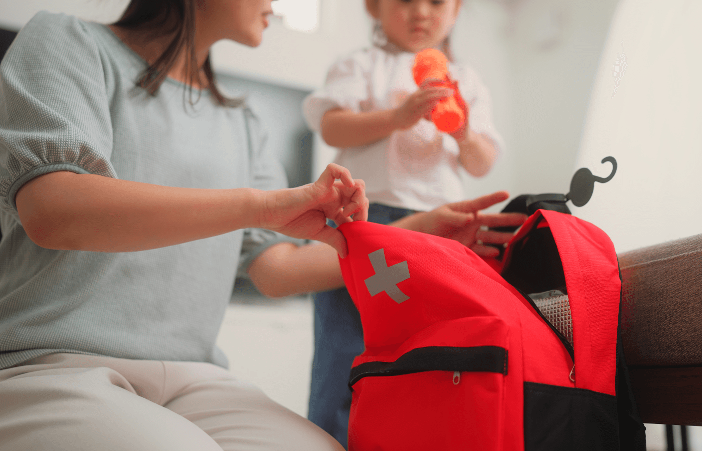 Woman preparing emergency bag at home