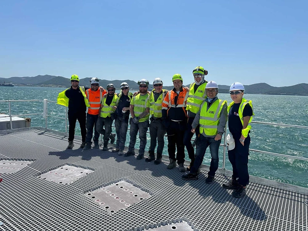 CASC technicians standing on an offshore transfer platform during project mobilisation
