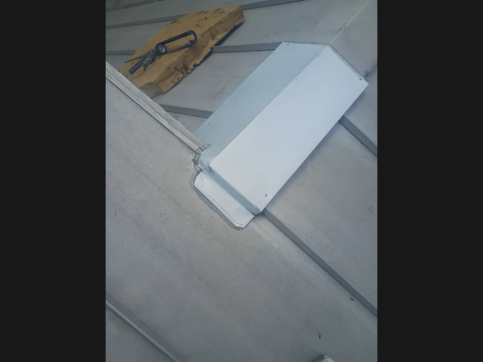Custom metal flashing at the roof transition in New Braunfels, Texas.