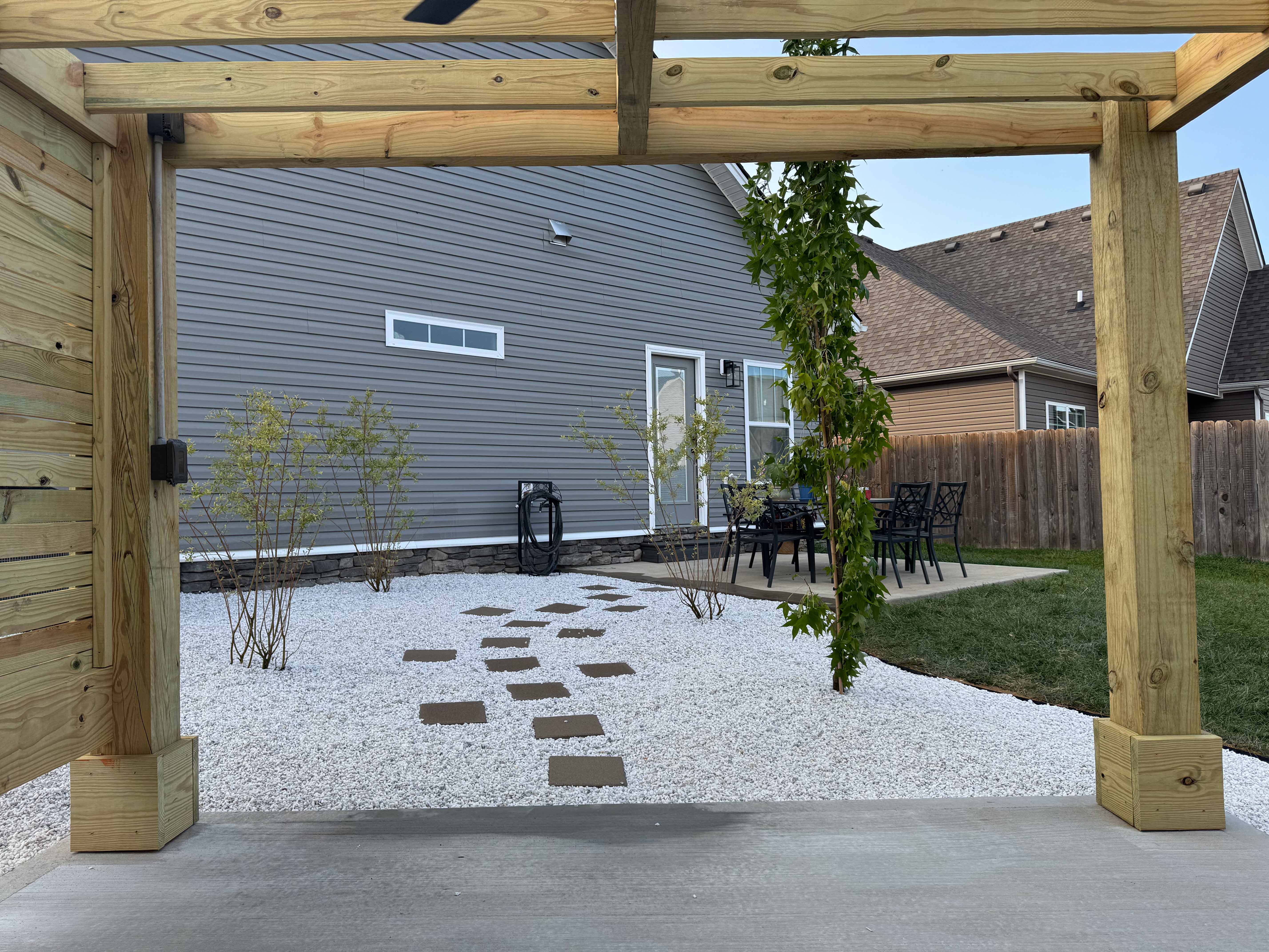 View from pavilion looking toward patio with stepping stones