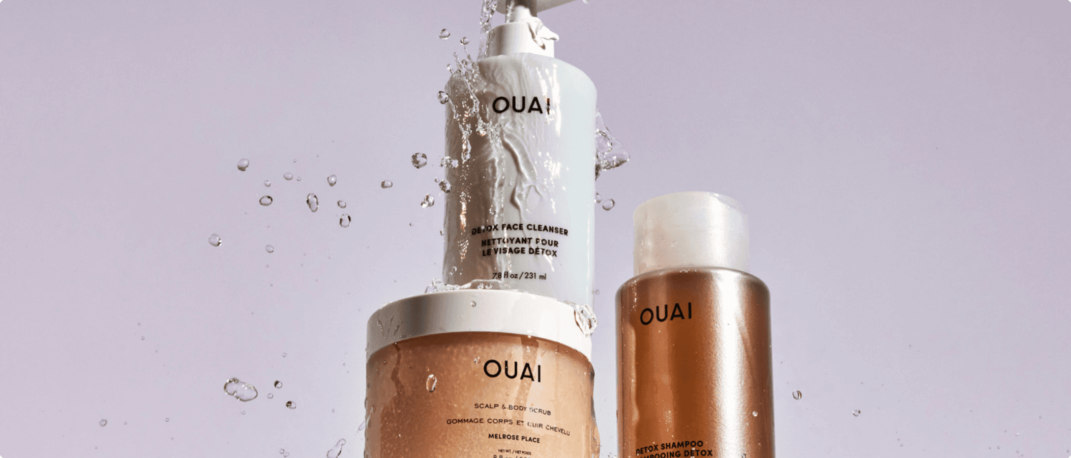 OUAI haircare product lineup featuring shampoo and treatment bottles