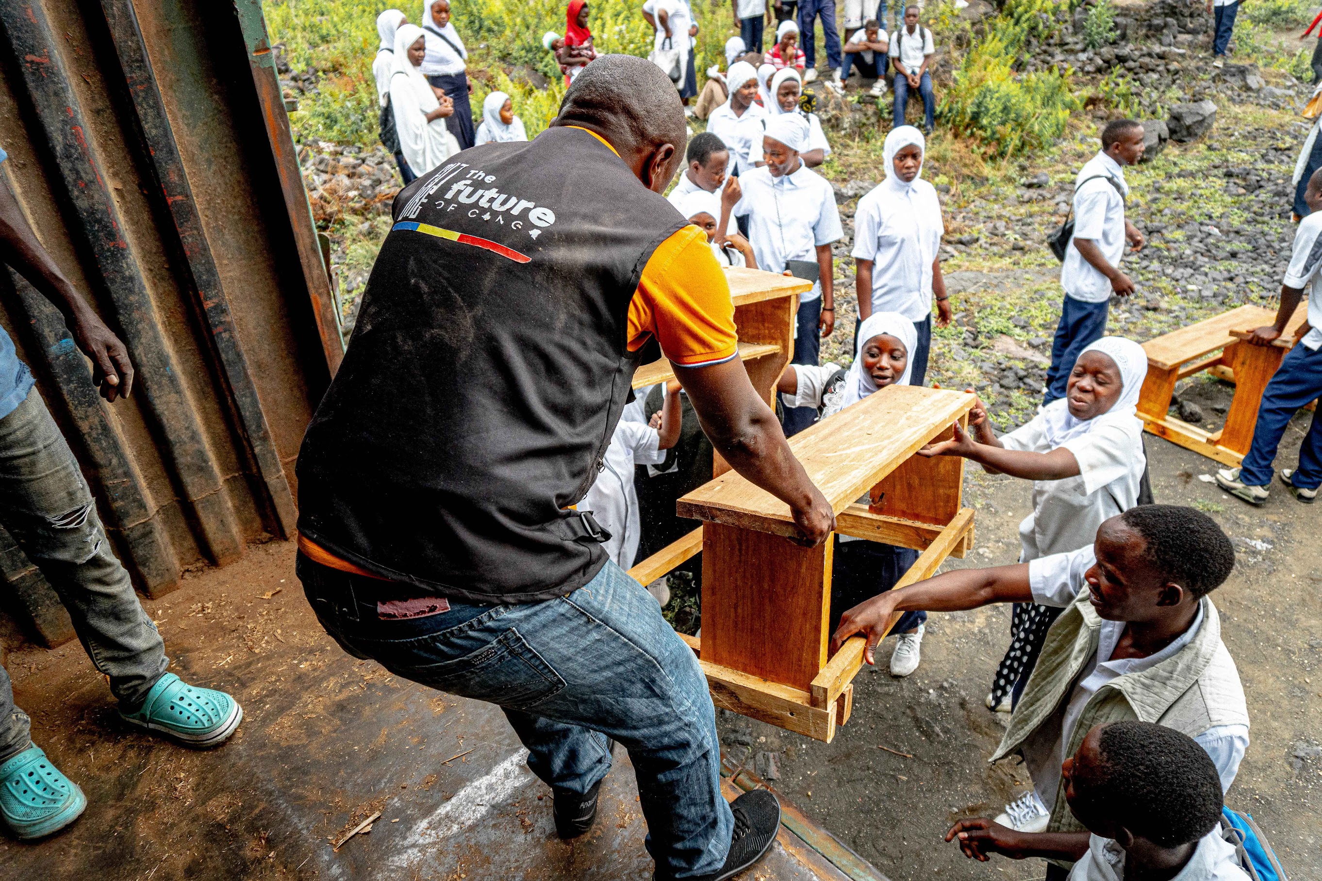 a group of people standing around each other
