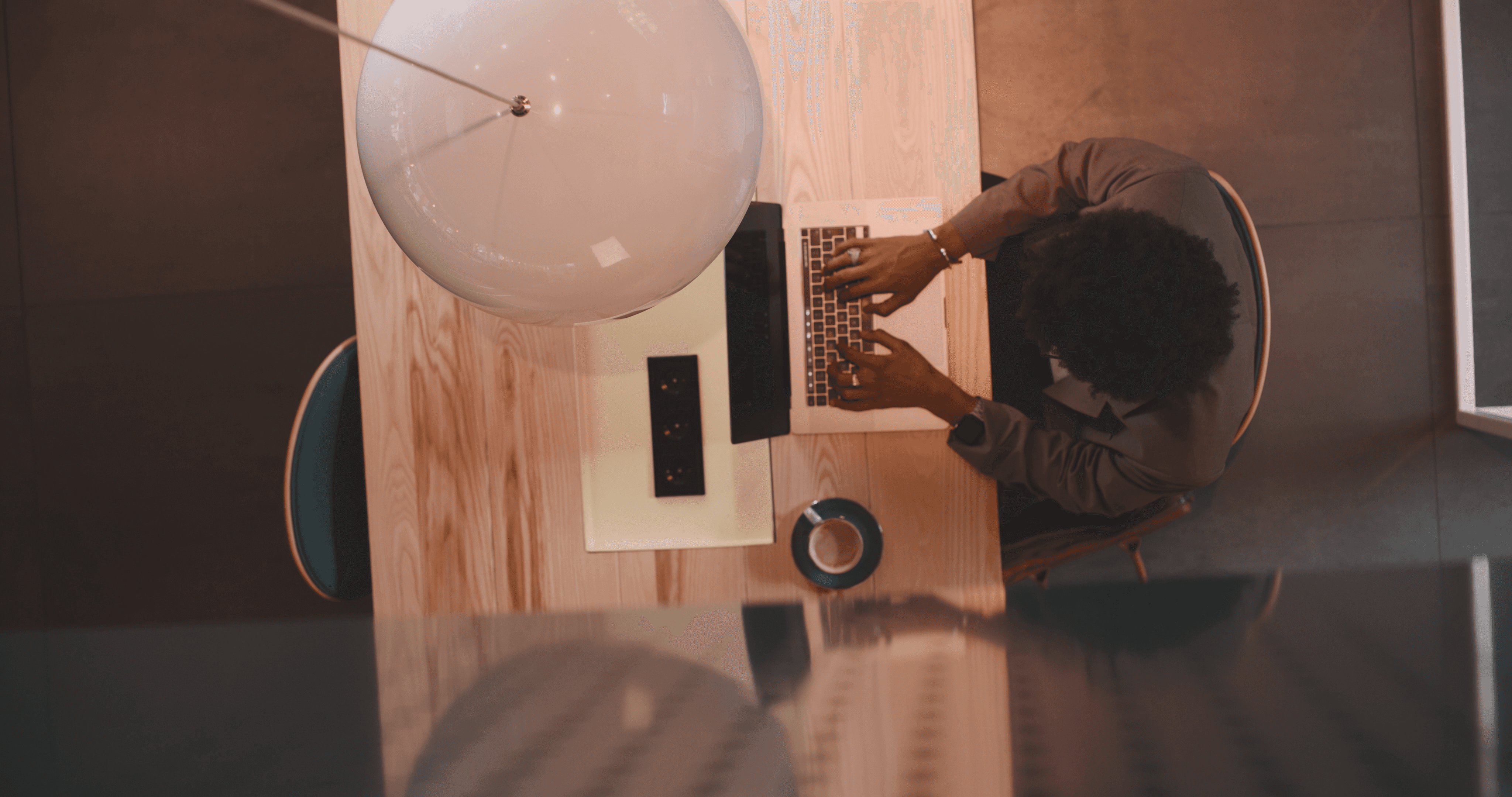 An indivual working on their laptop.