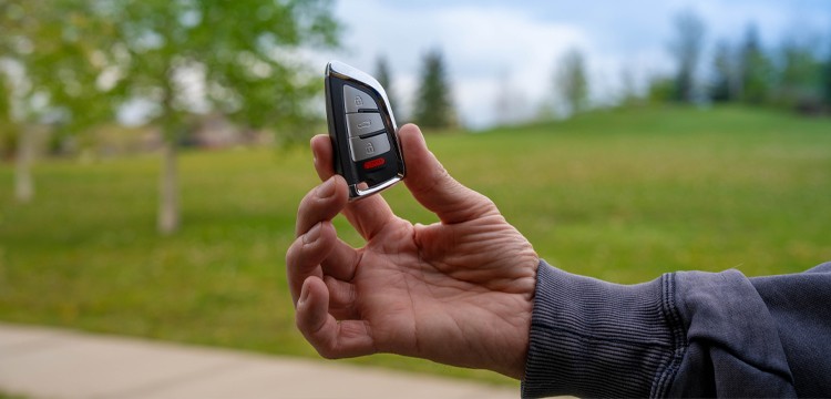 person holding proximity key