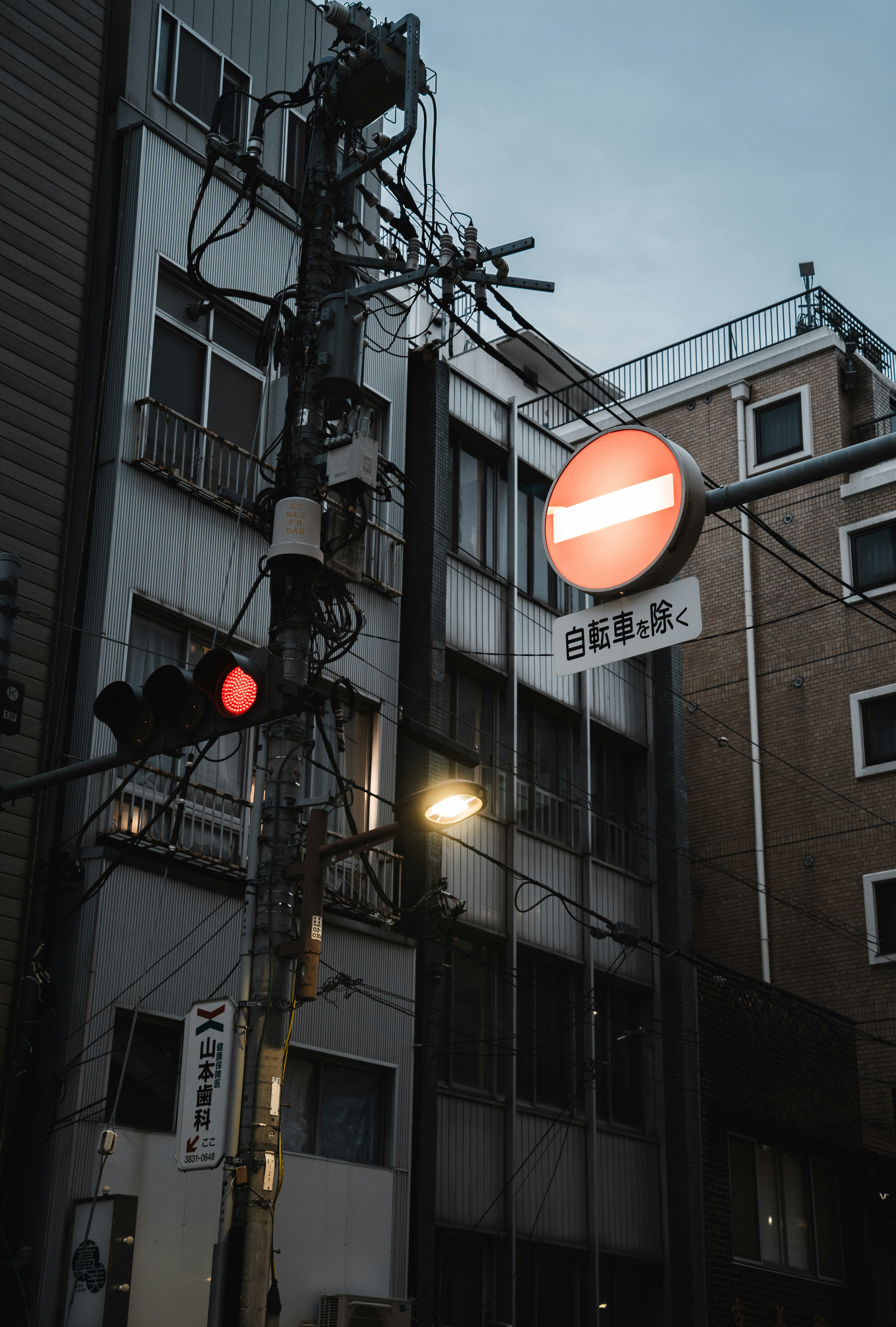 Street scene with traffic lights and signs.