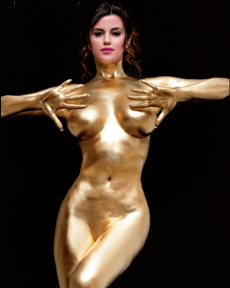 A lone astronaut sitting on a rocky surface, gazing at Earth from space.