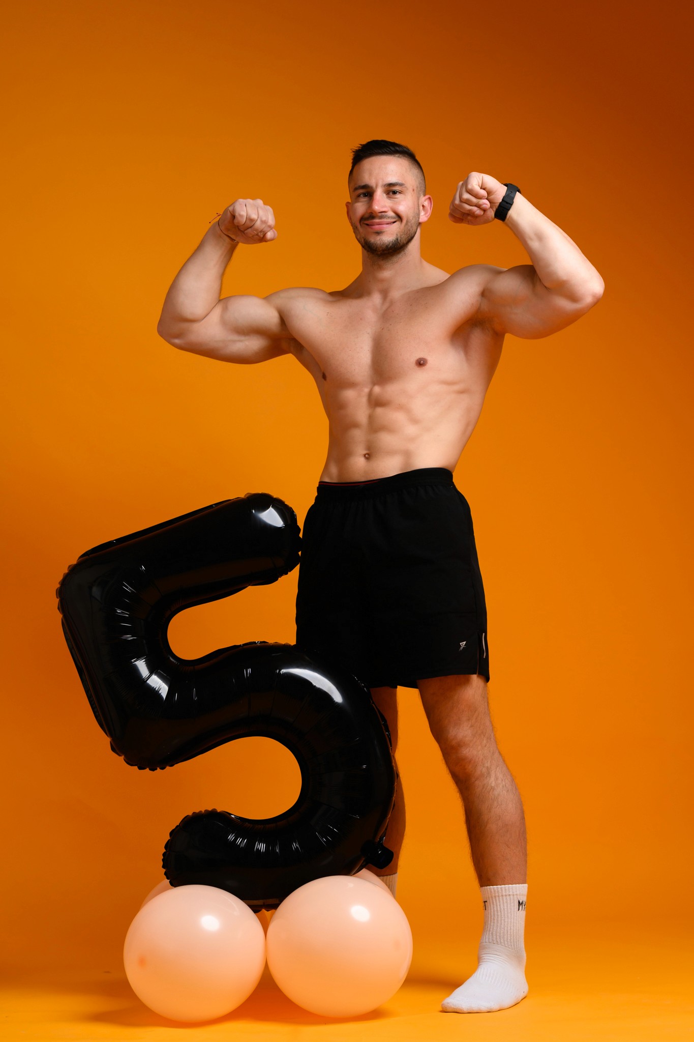 Man doing shoulder workout in the gym