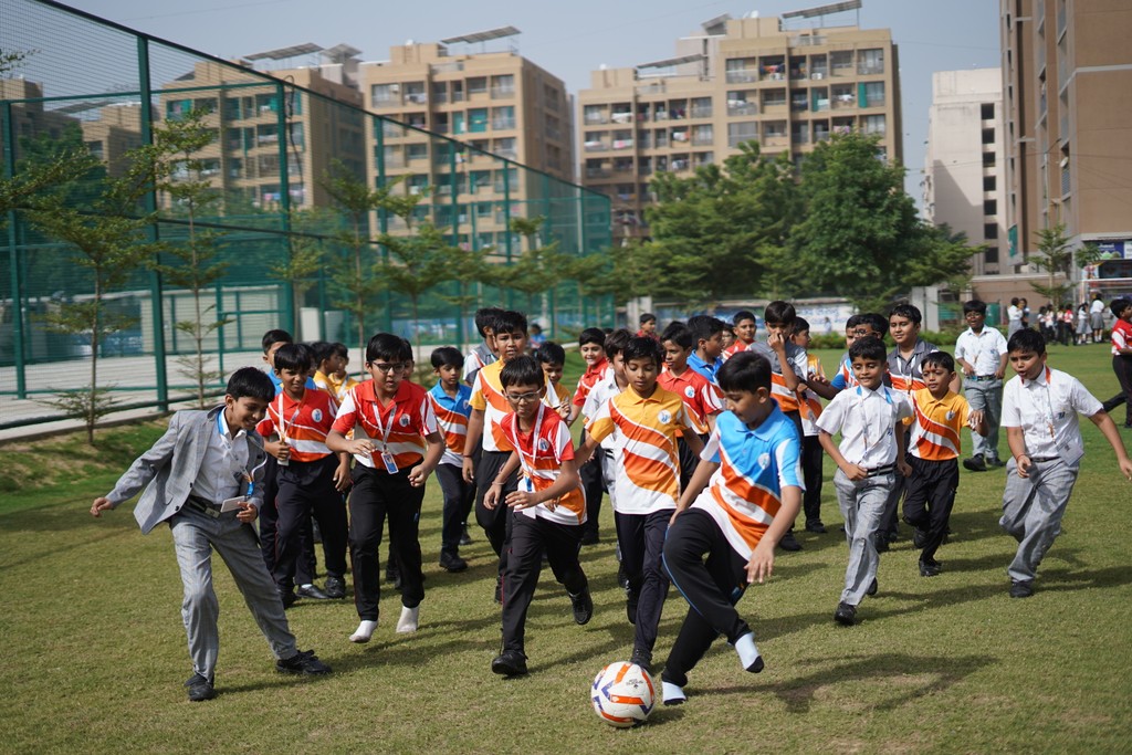 A man stading with Surfboard