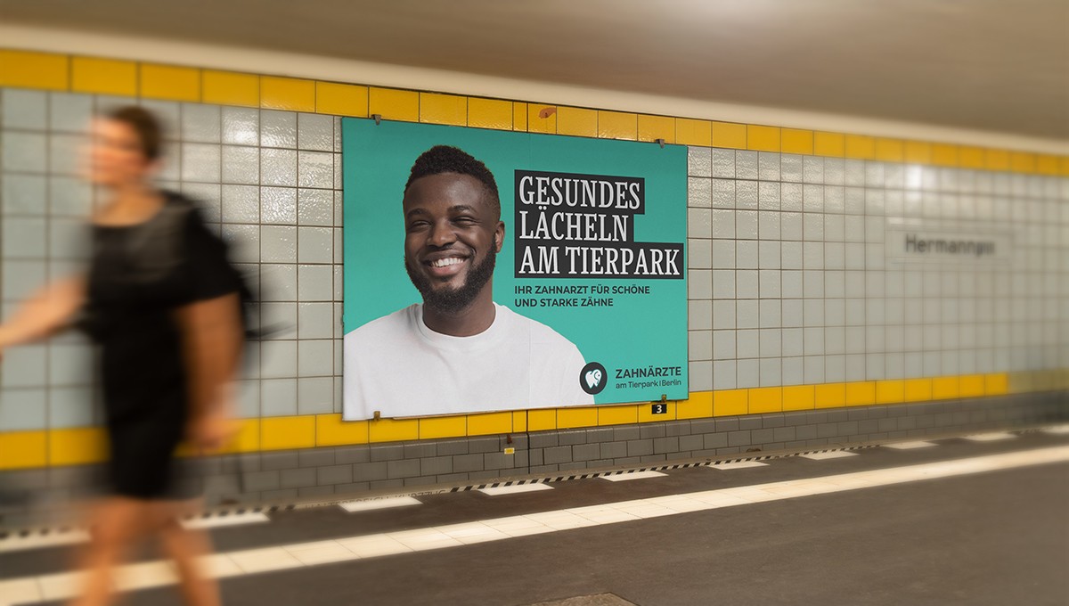 Family standing in a lush green field with tractor.