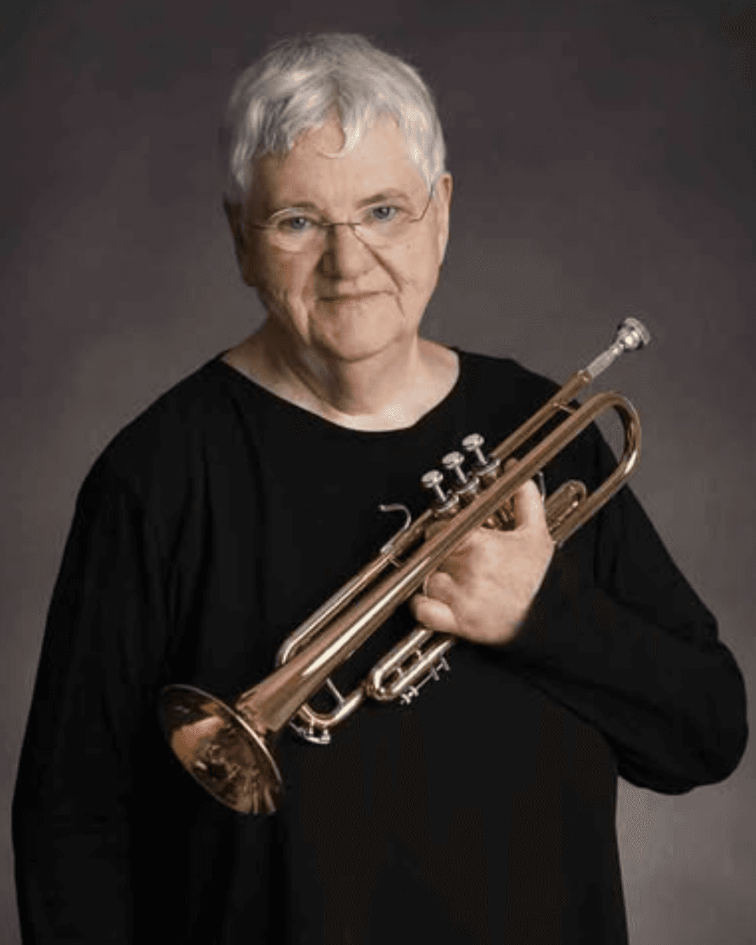 baby playing multicolored xylophone toy