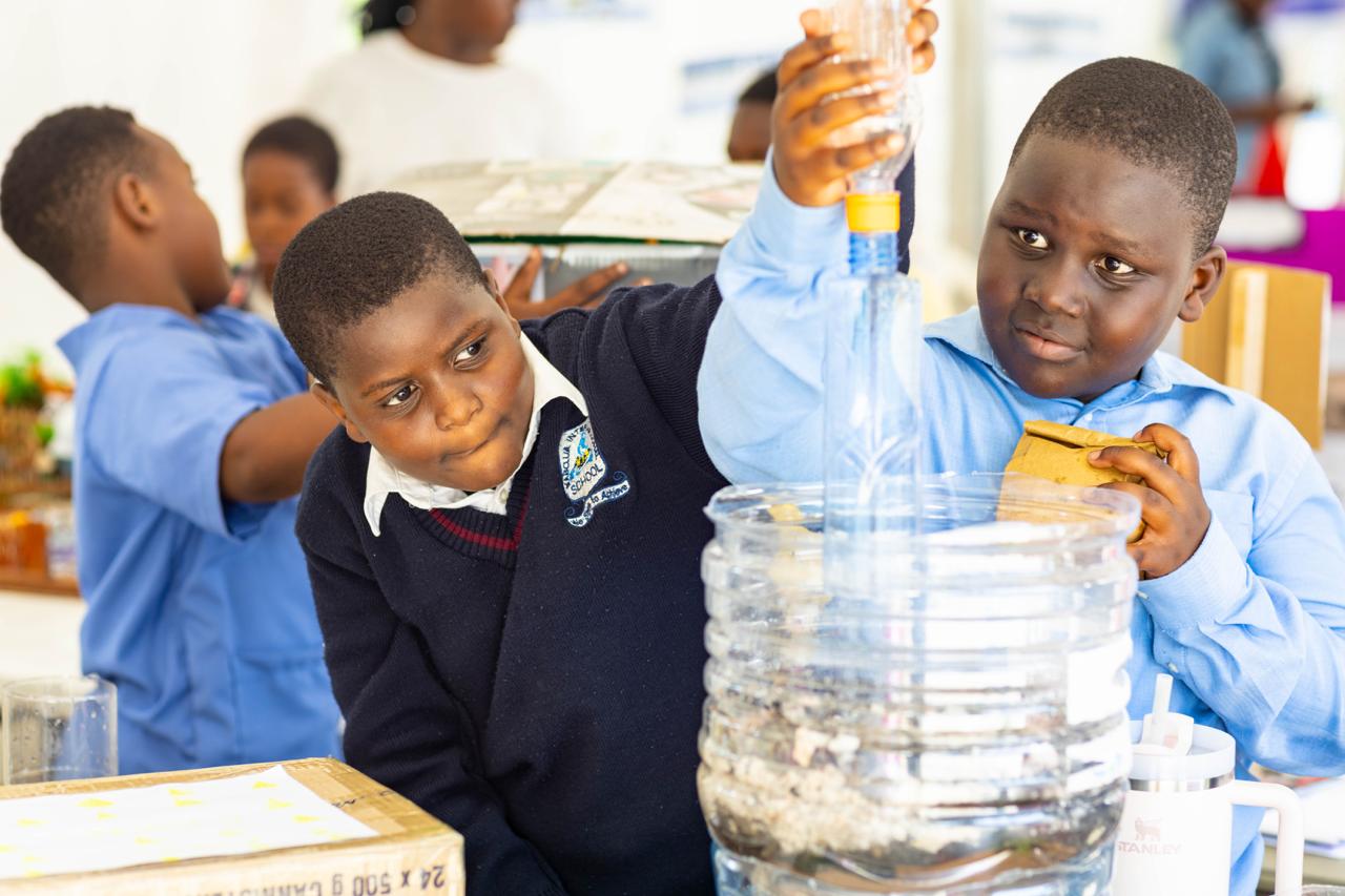 A student stands with a backpack on, ready for school