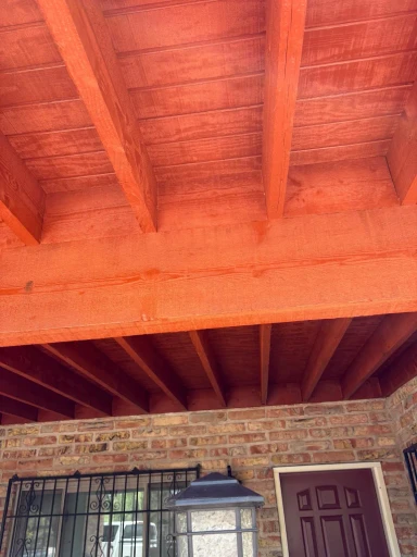 Exposed wood-beam ceiling at a Tucson entry