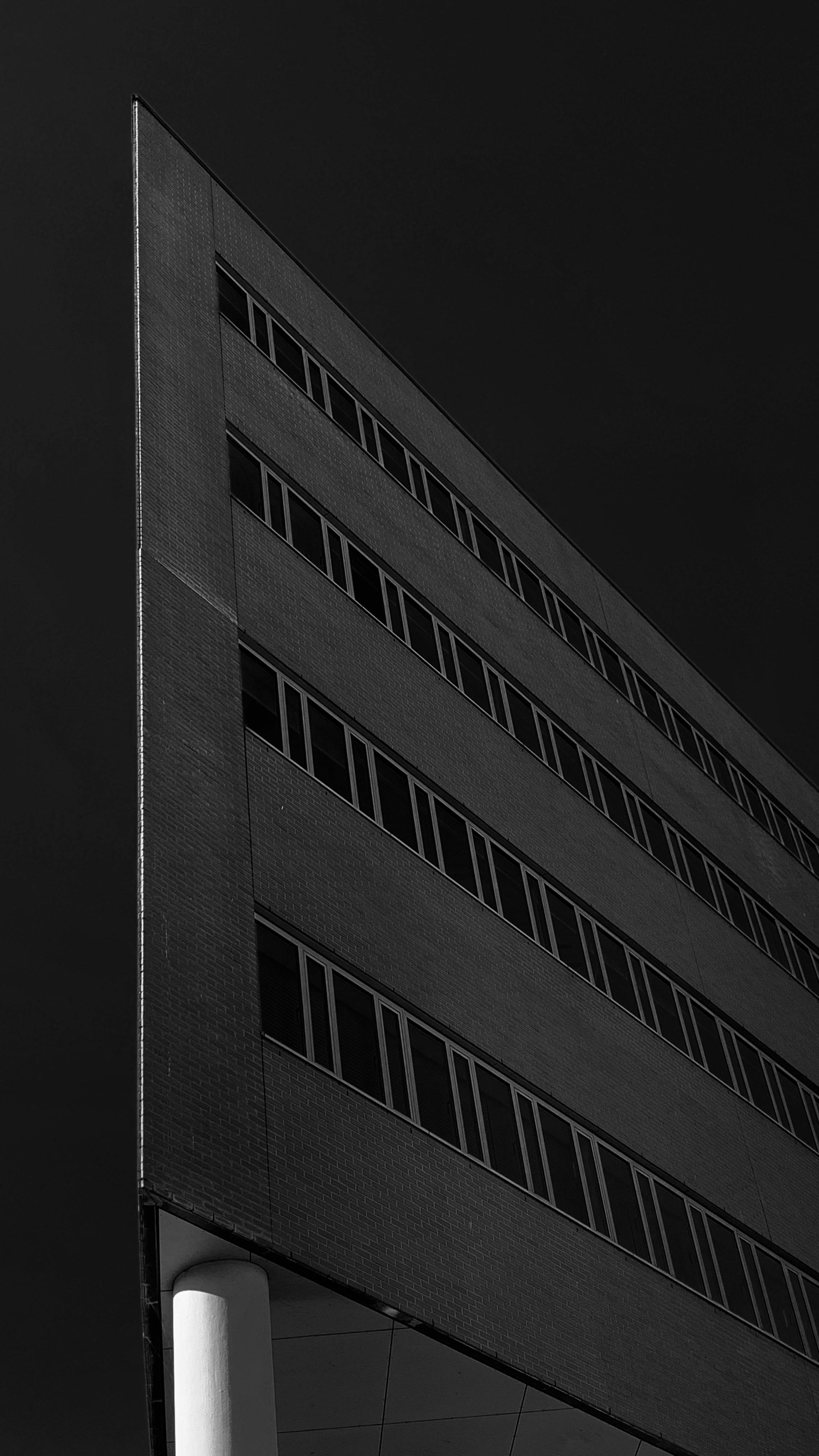 Side view of a dark themed building.