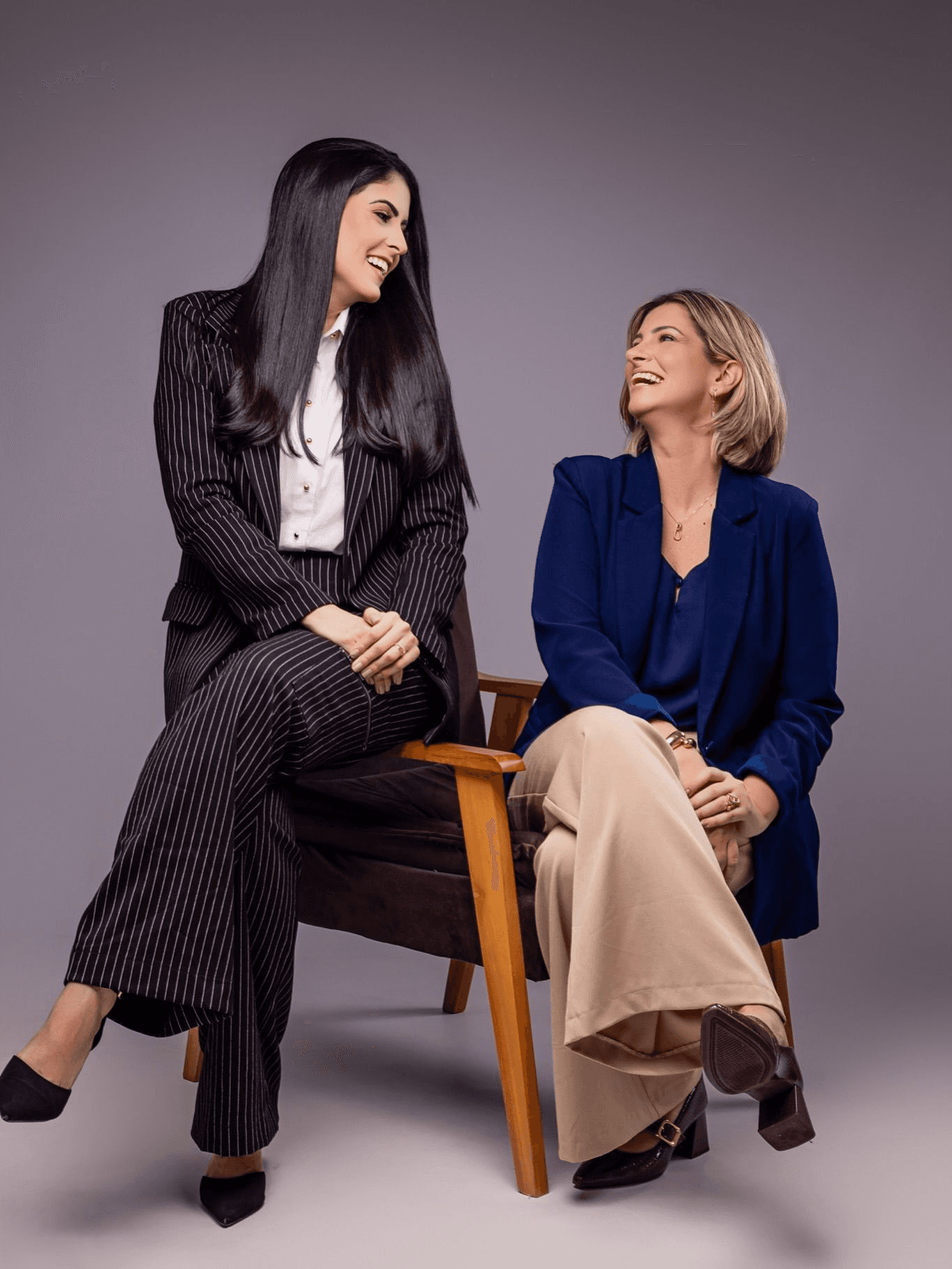 person sitting in a chair in front of a man