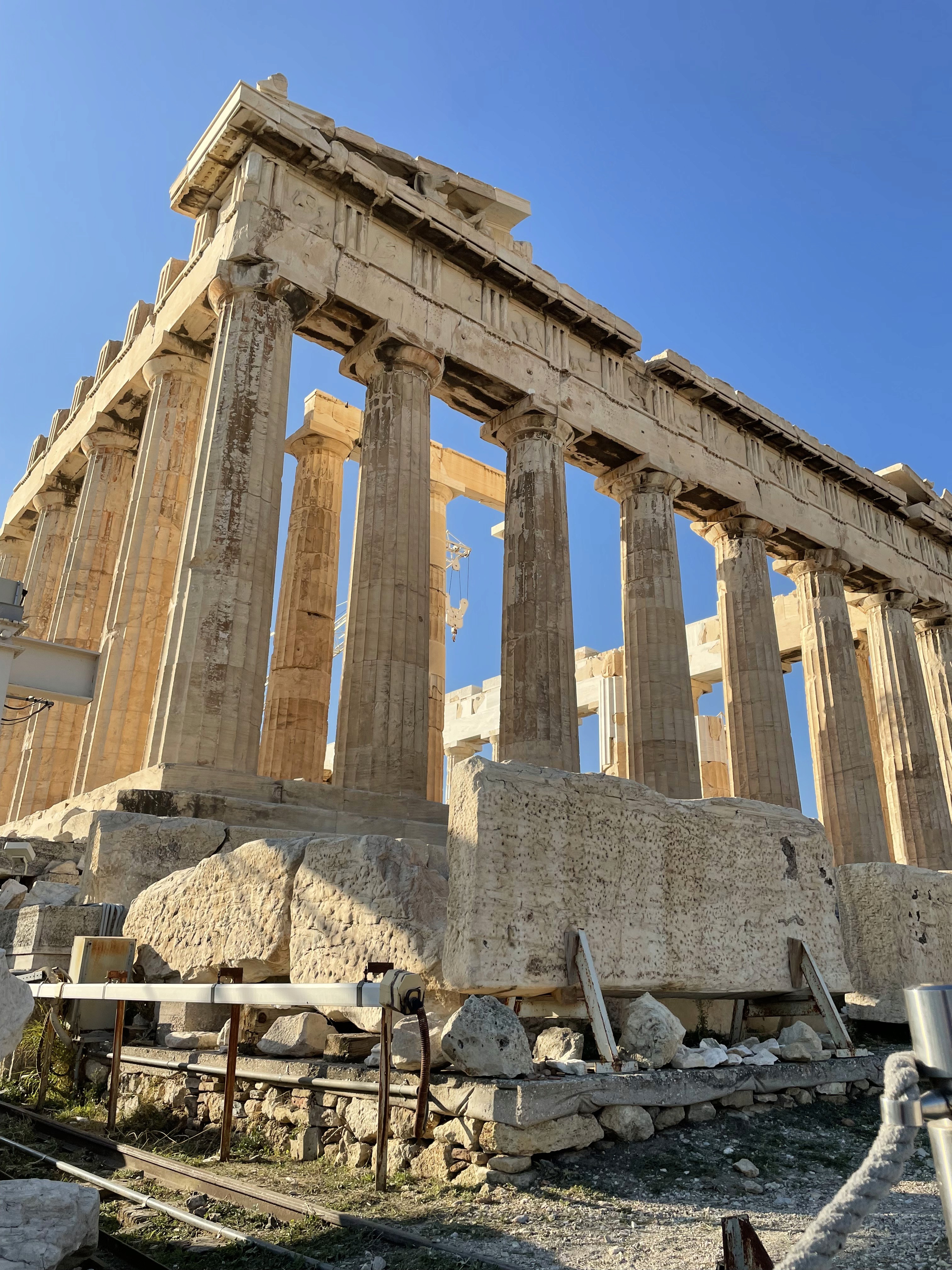 green chairs under umbrellas on shore