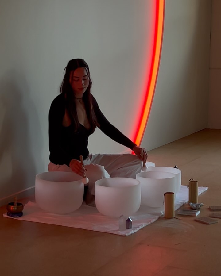 Black cosmetic product bottle against a dark background