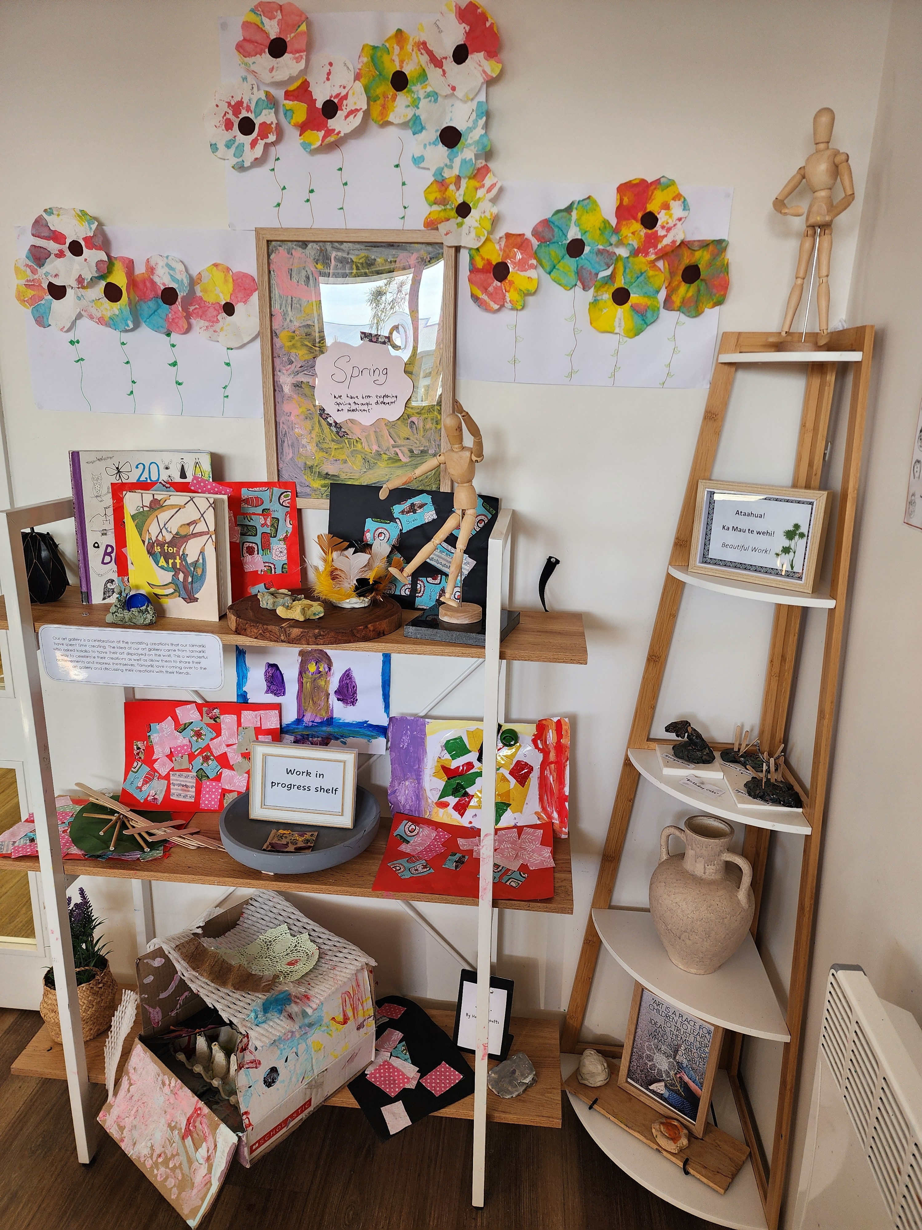 Young children engage in supervised water play with a teacher in an outdoor early childhood environment.