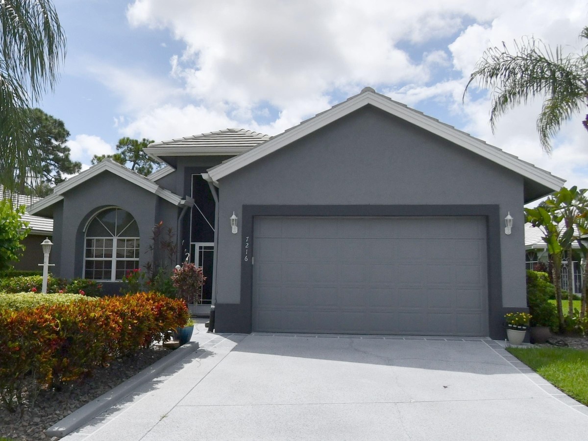 1995 New Roof Construction in Marsh Landing, PGA Village, Port St Lucie with Entegra Flat Broomswept Tile in Natural Gray