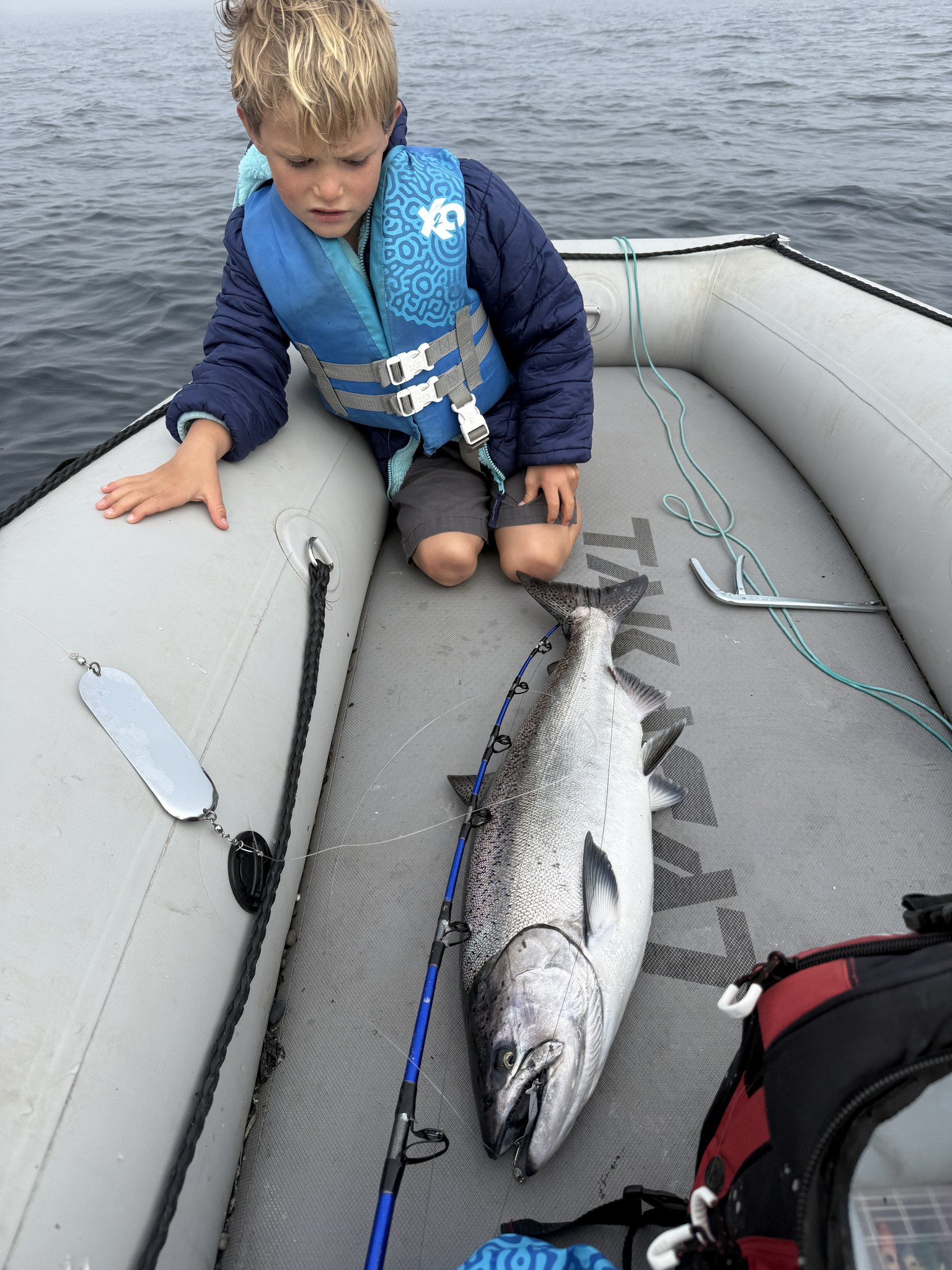 Hyrum with a salmon catch on the boat