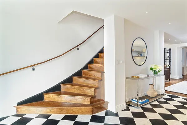 Entry and curved staircase at 1145 Park Avenue