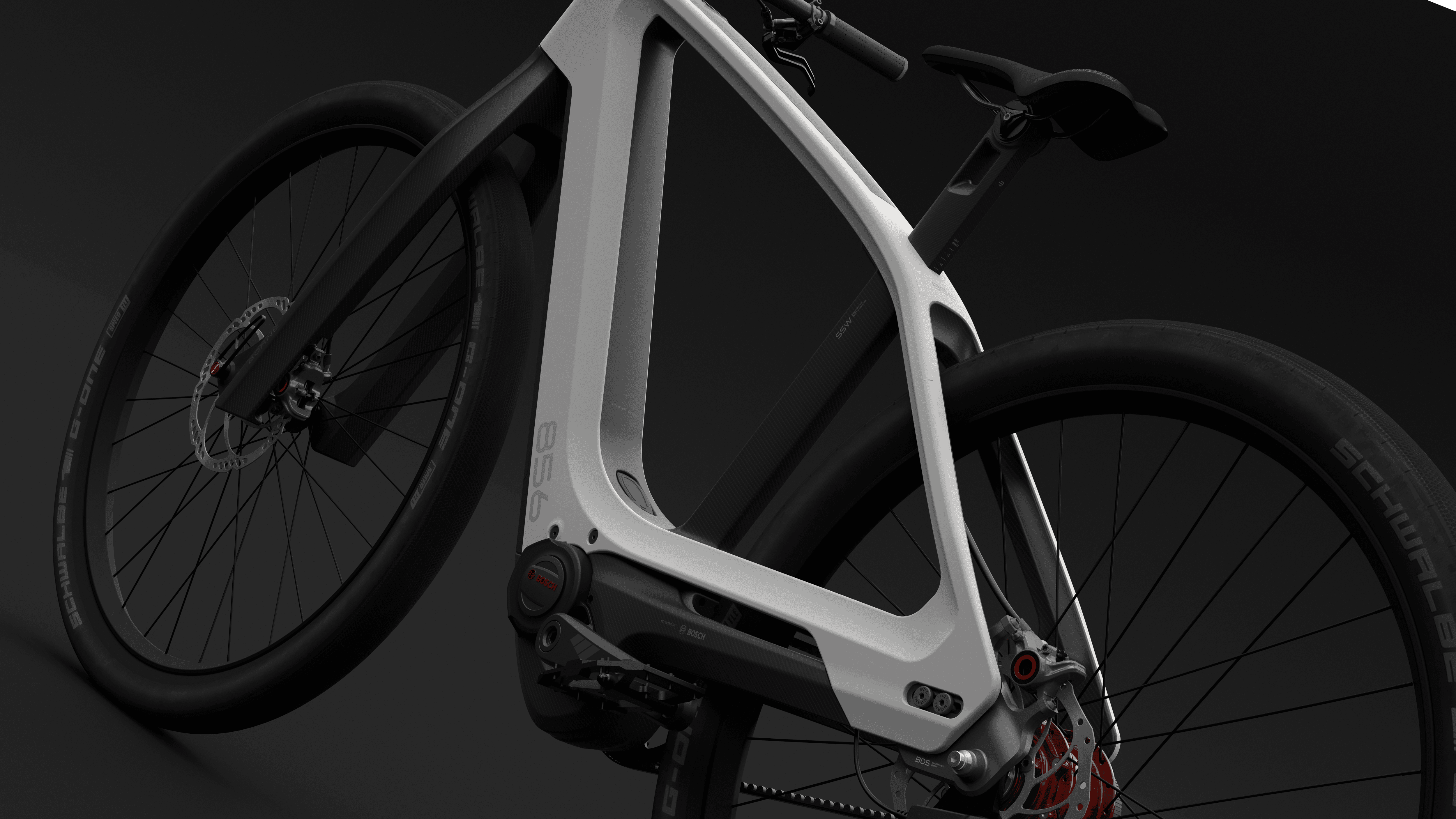 Close-up render of a white and black electric bike frame with a mid-drive motor, red brake disc and Schwalbe tyres, on a dark background