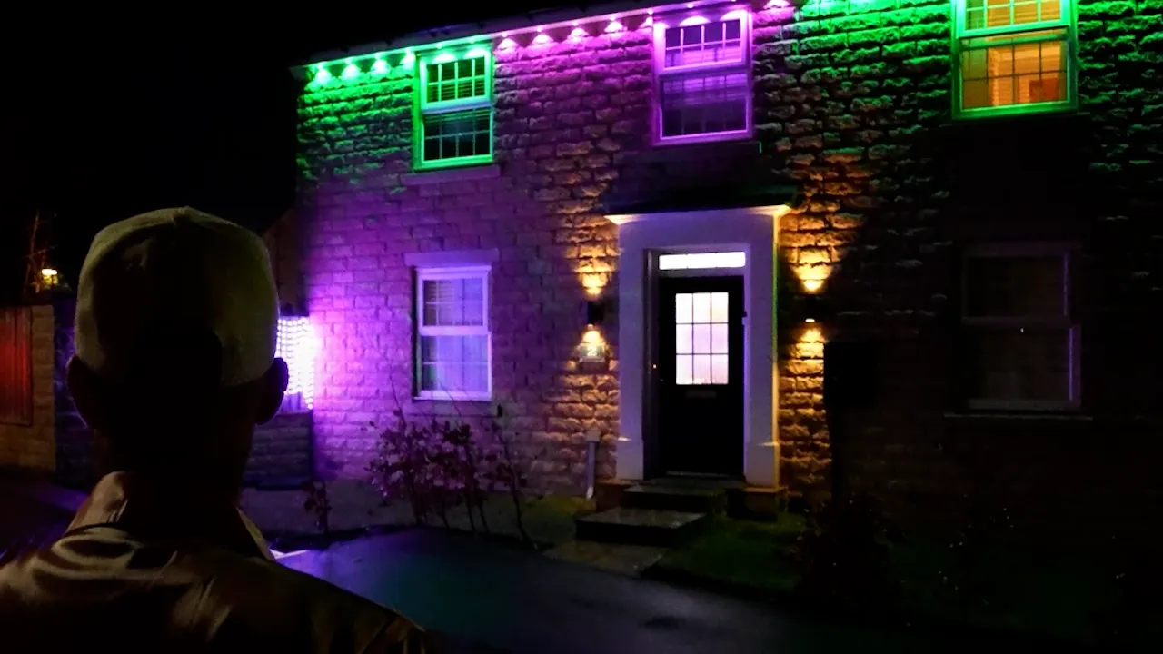 Exterior of the Wicked Movie Night venue illuminated with themed green and purple lighting, filmed during a private event video production.