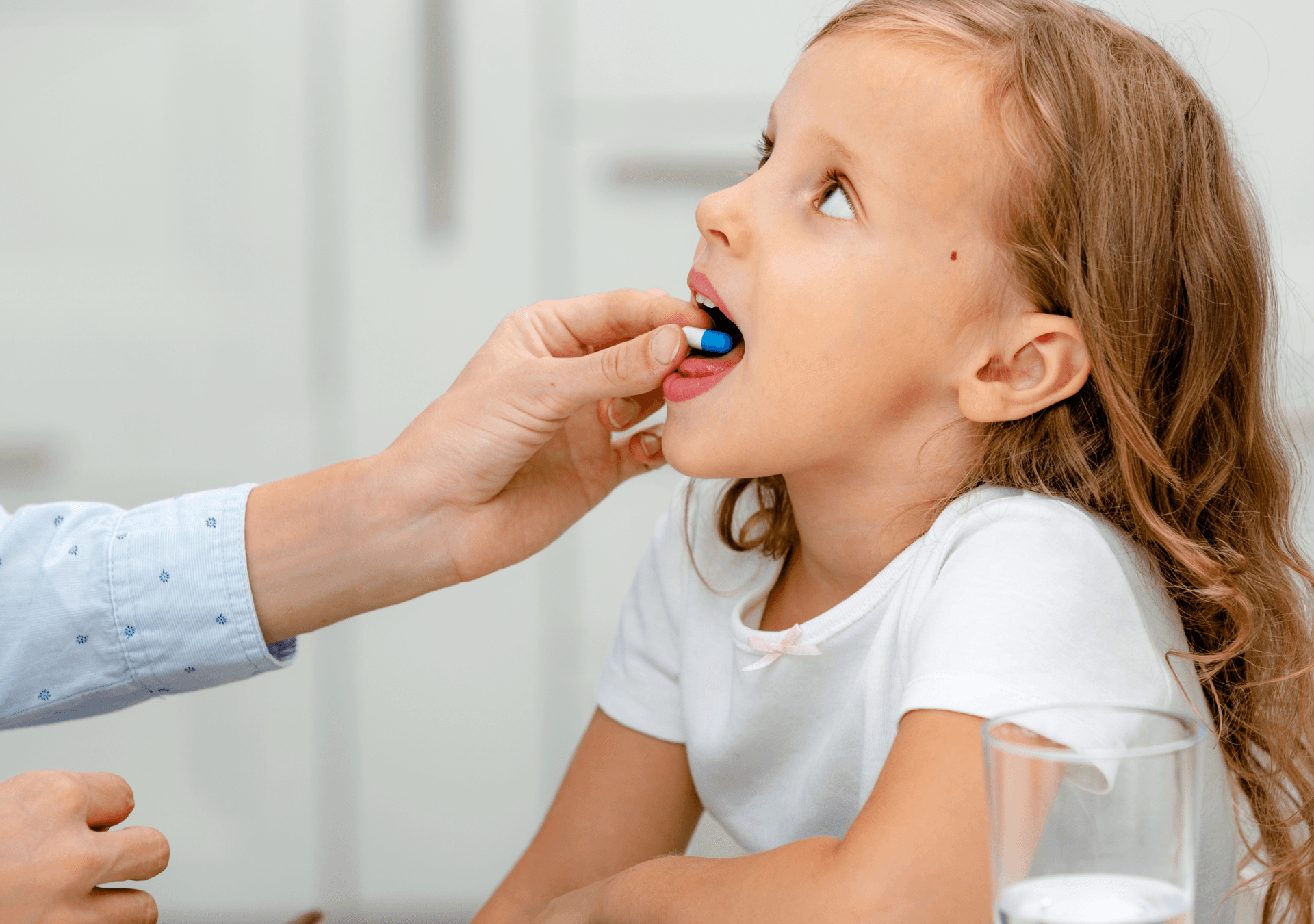 child taking antibiotics