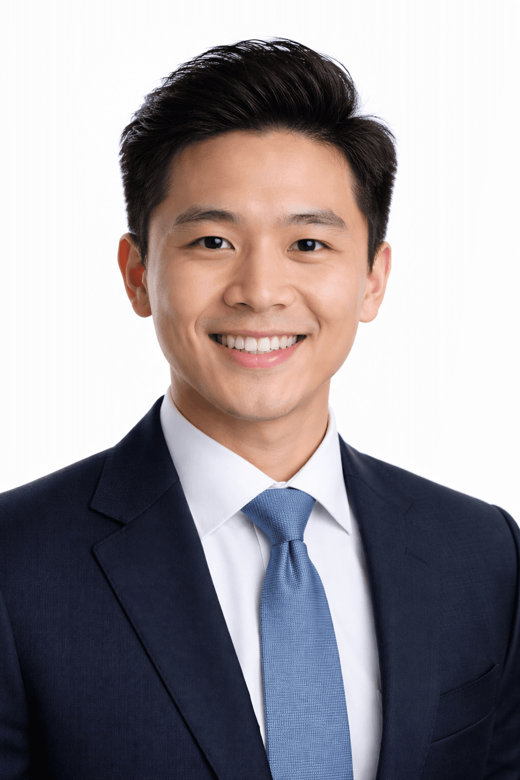 a man with a goatee smiles at the camera