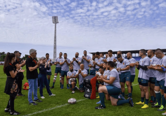 montenegro rugby squad with people from british embassy