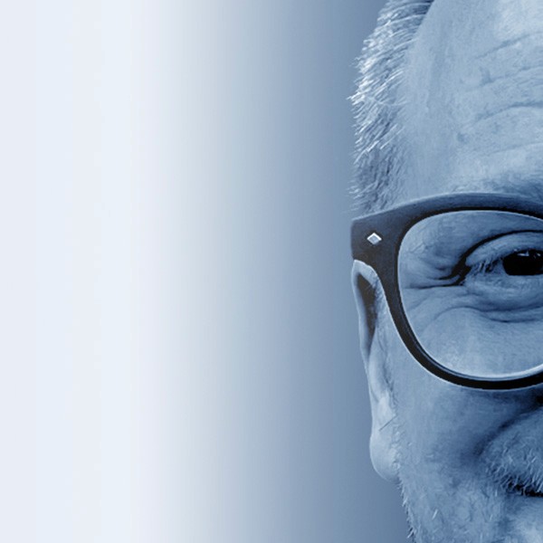 Grayscale close-up portrait of Jeremy J. McLean, Senior UX, Visual, and Motion Designer, featured in hero banner with gradient blue background.