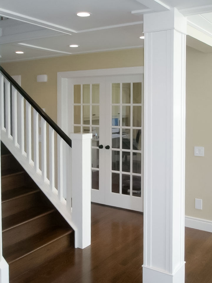 Image of Luxury home interior with staircase, glass doors, and design elements by KHD Homes.