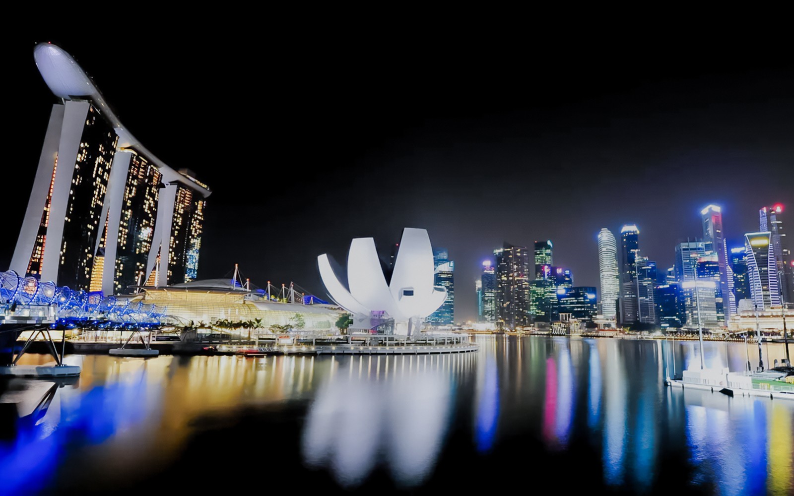 Marina Bay Sands yacht cruise with city skyline in Singapore.