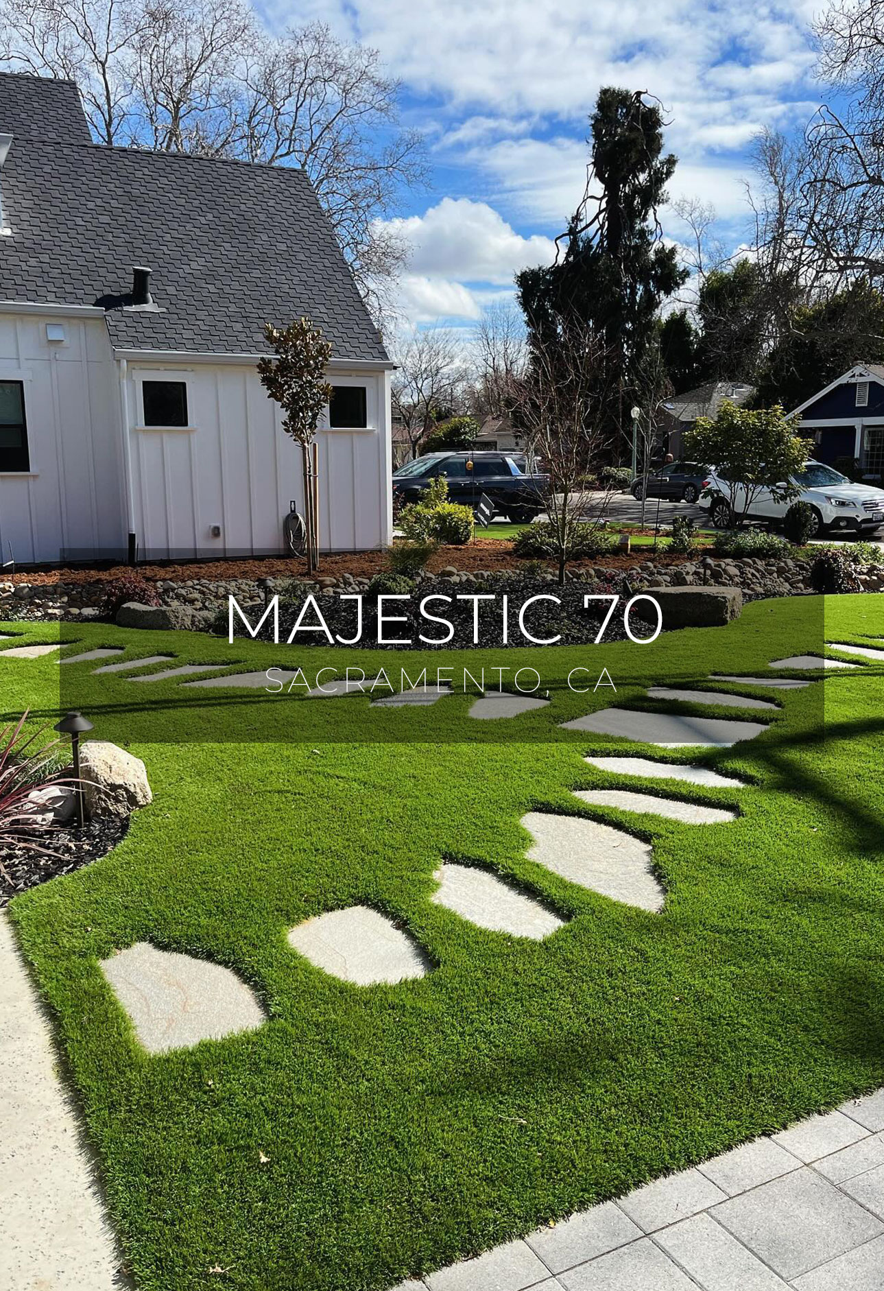 In this photograph shot in Sacramento, CA., two stone paths diverge, depicting Majestic 70 artificial turf by AGL Grass North.