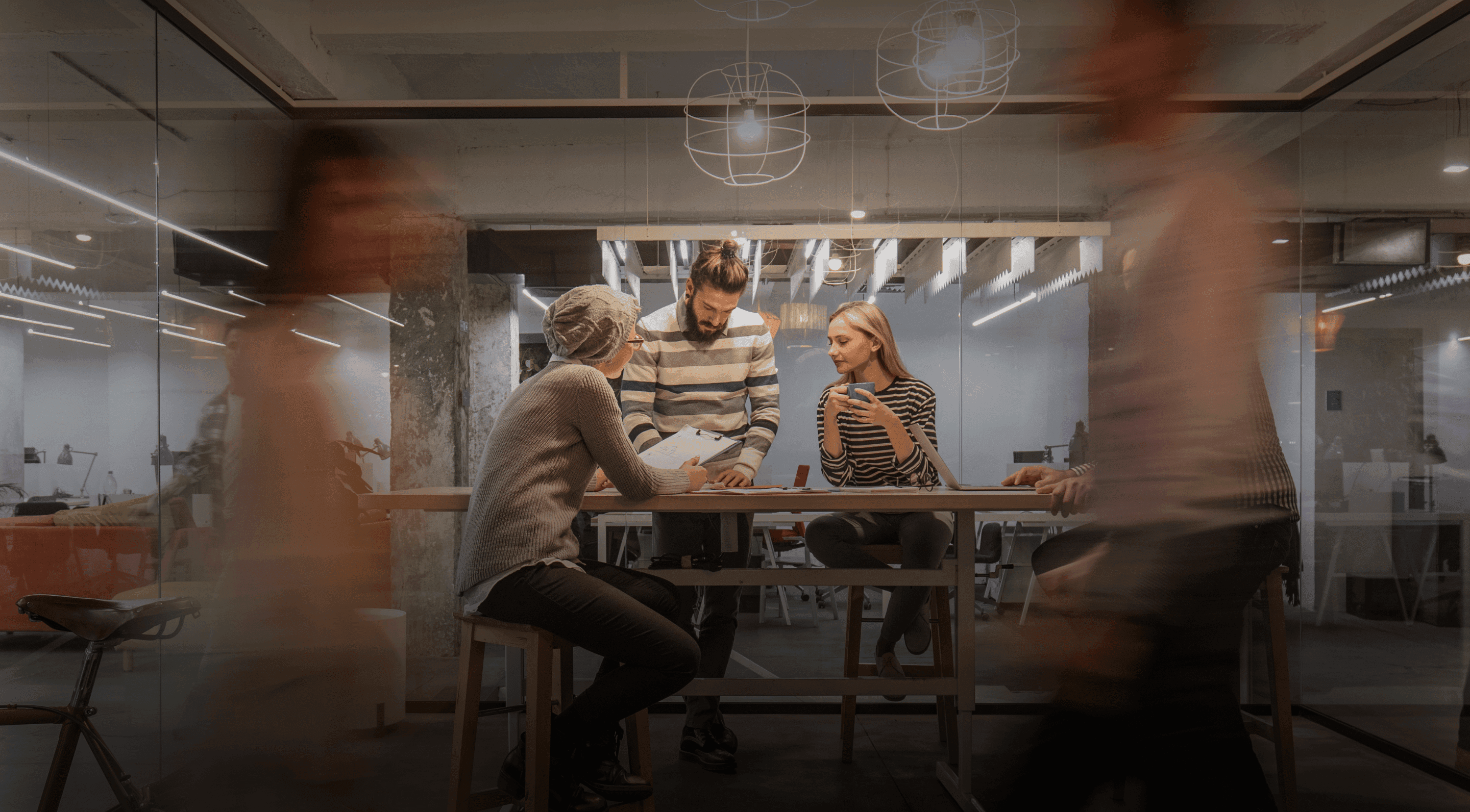 Three members of staff working hard in the office