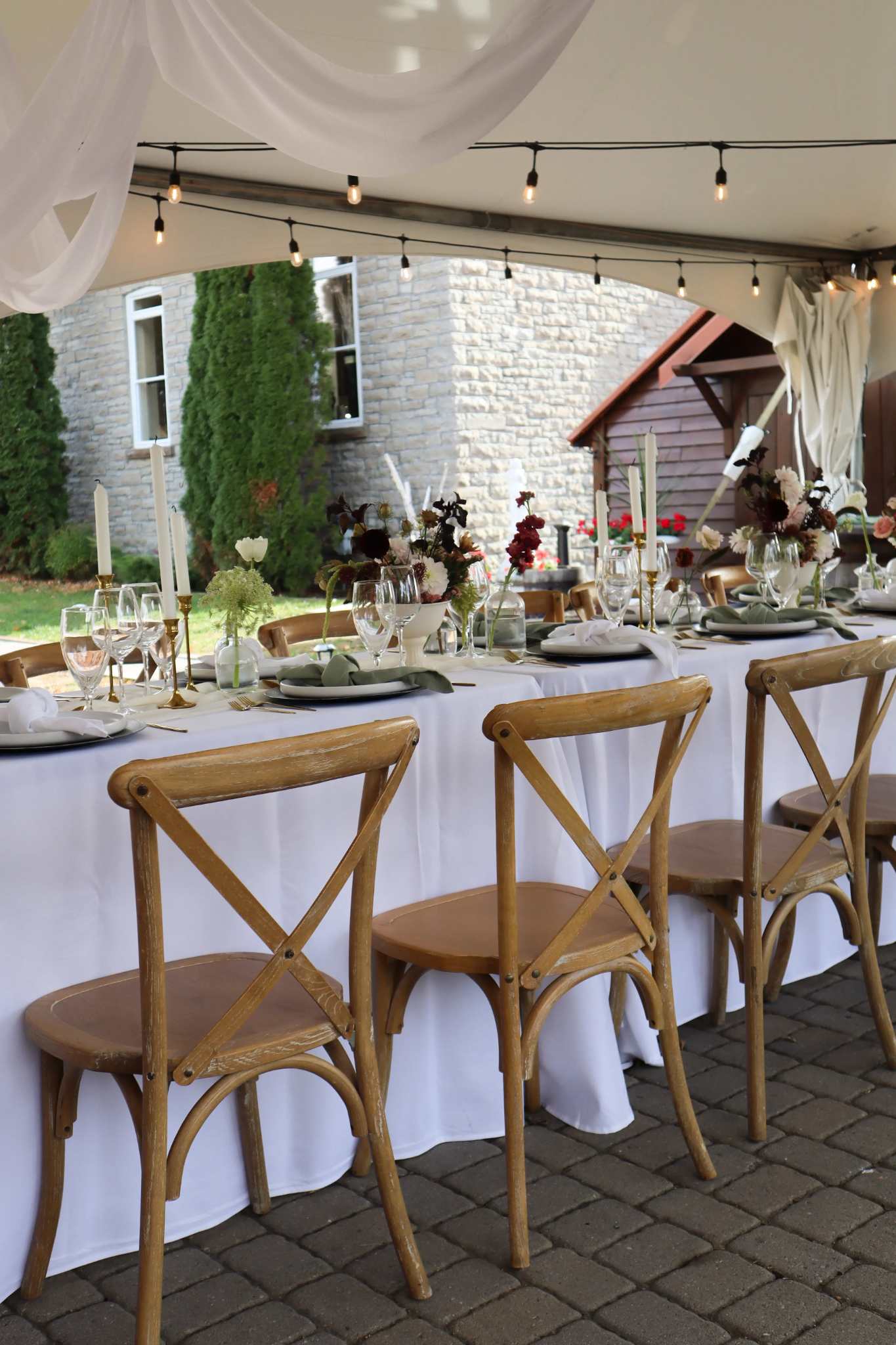 Cross back chairs set up for private dinner event at Ashlar