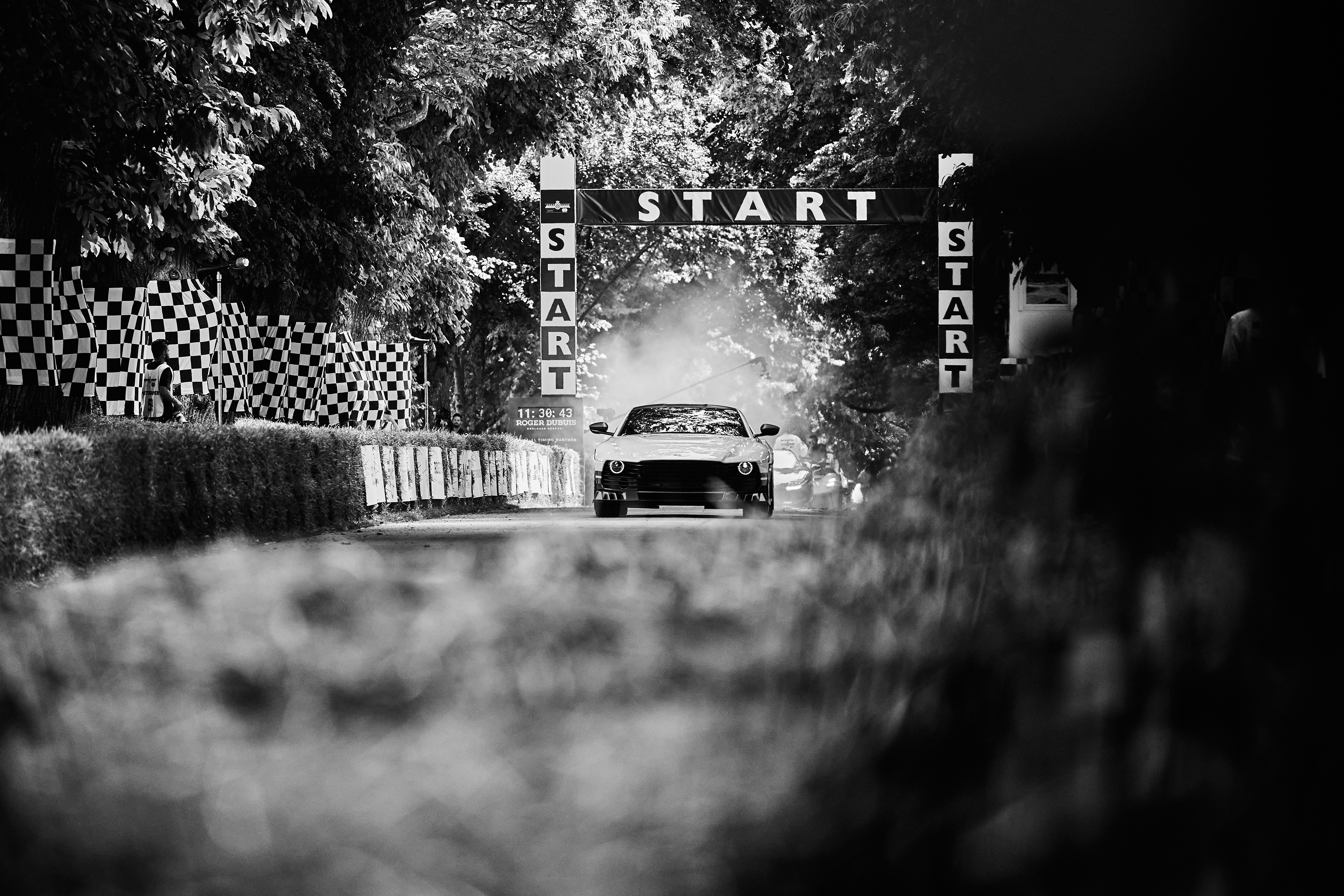 Black and white image of Aston Martin at the Hill Climb at Goodwood Festival of Speed, event imagery captured by Paul Severn