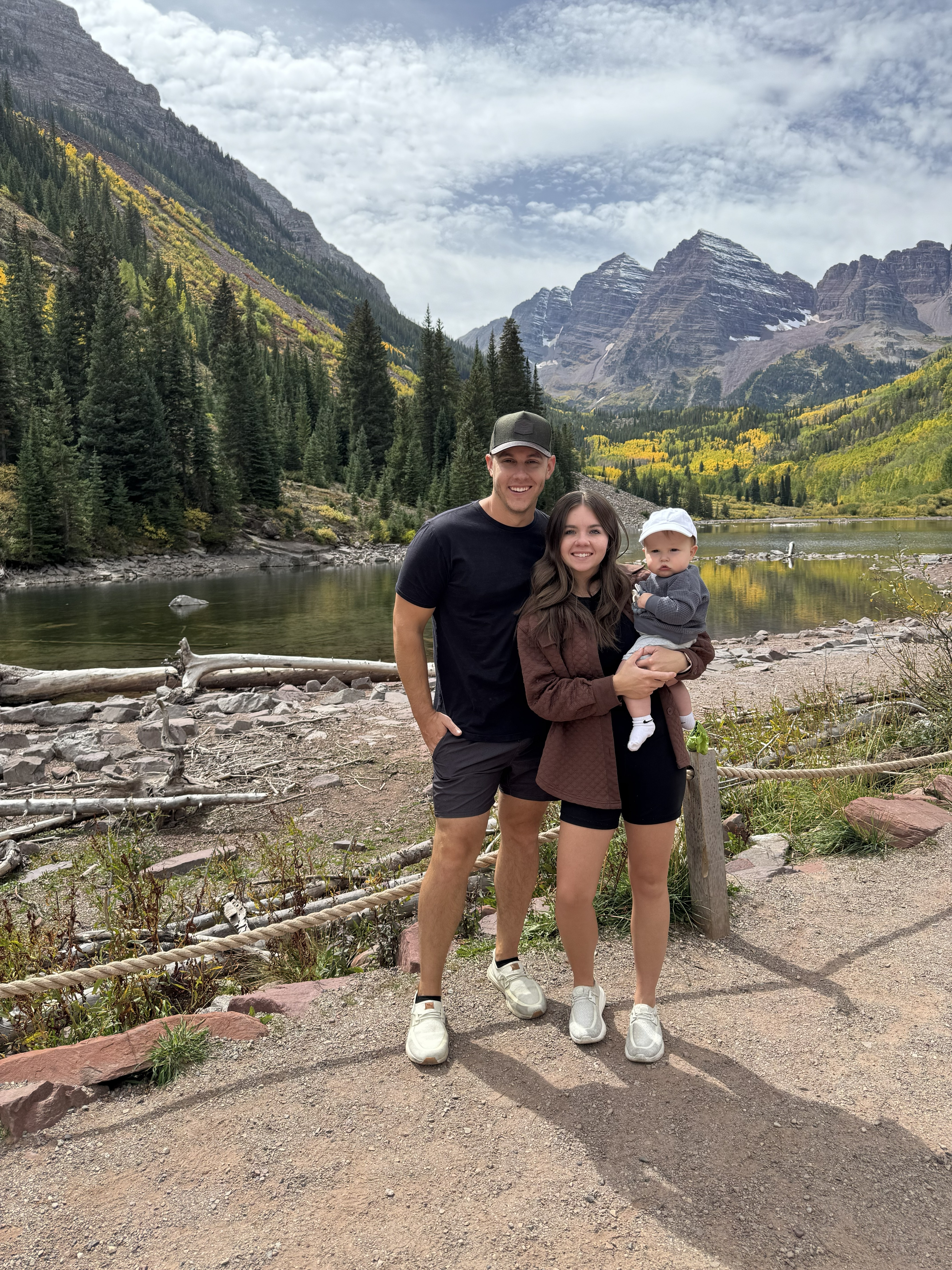 Matt outdoors with his wife and son at Maroon Bells
