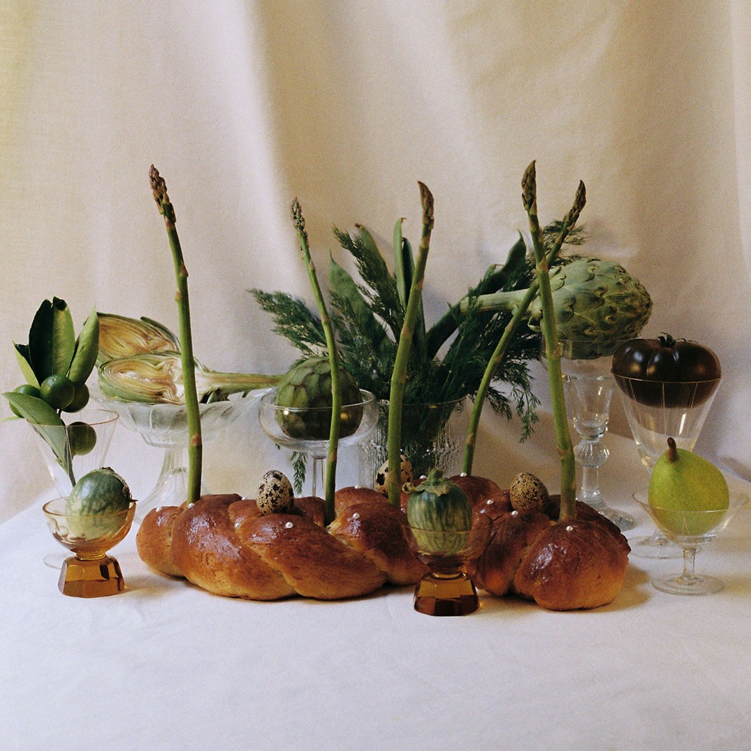 A small furry animal rests on a rock