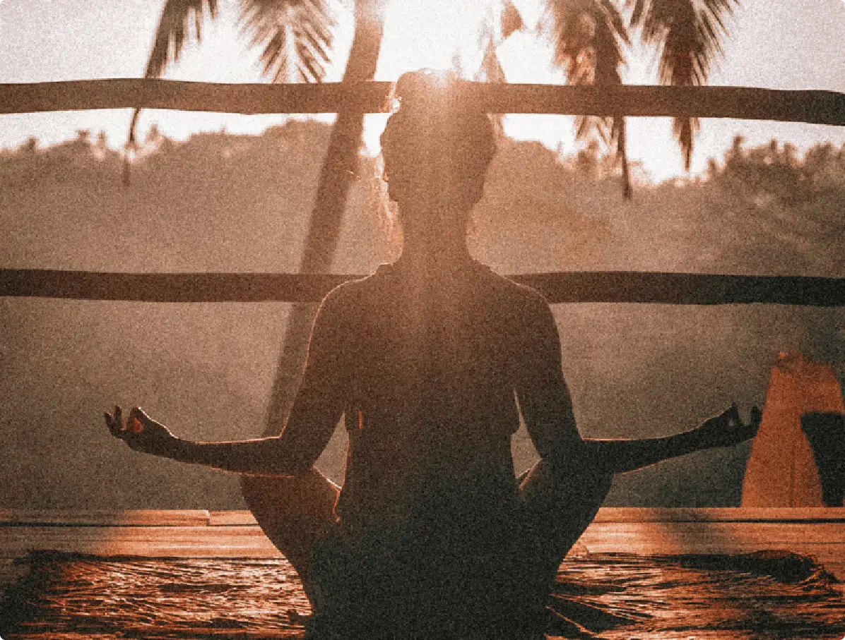woman doing yoga meditation on brown parquet flooring