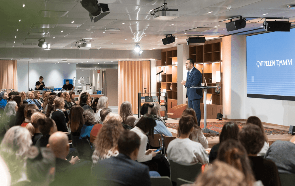 brown and gray concrete building near body of water during daytime