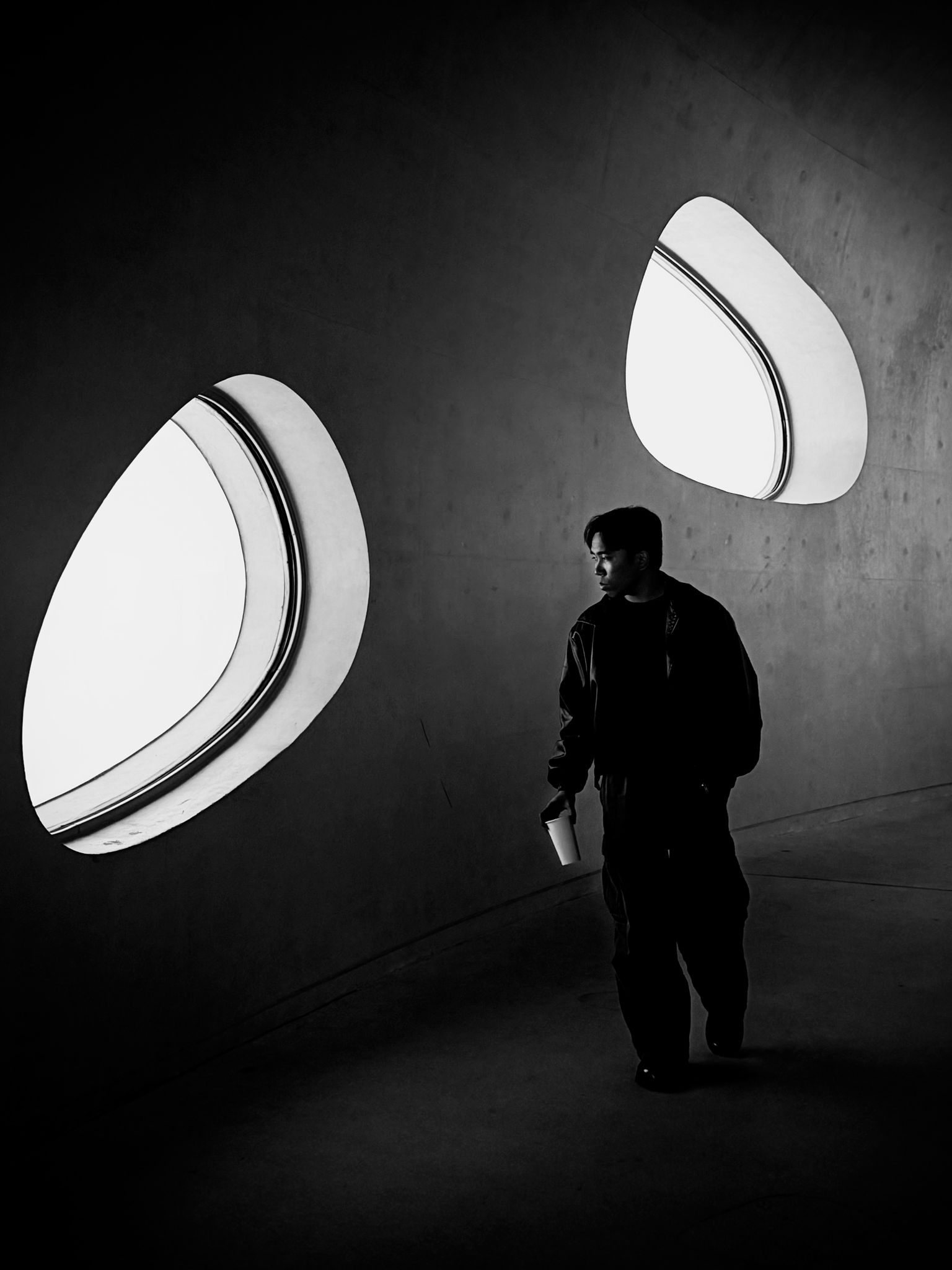 a blurry photo of a person standing in front of a wall