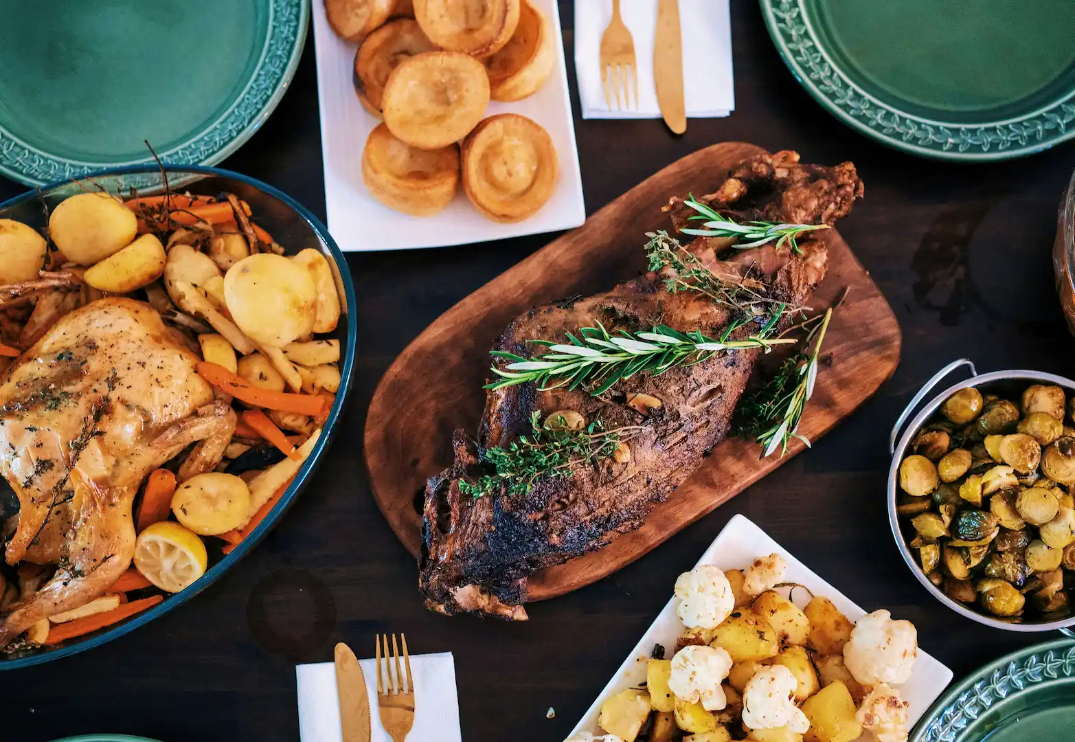 Roasted chicken and lamb with roasted vegetables and Yorkshire puddings.