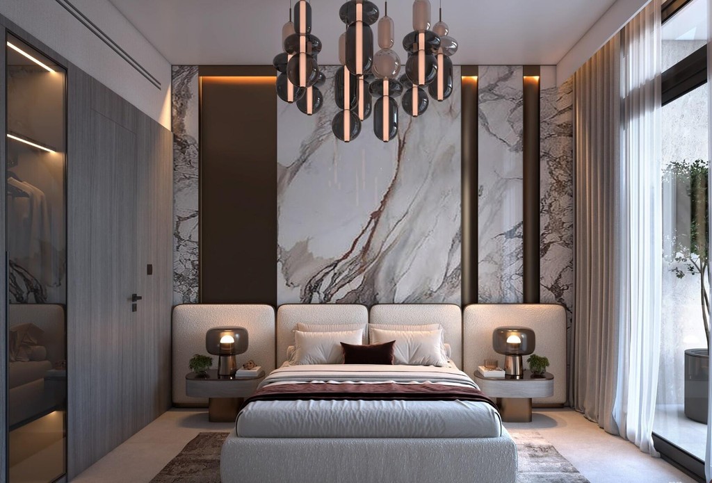 Contemporary bedroom with luxurious marble walls and a chic chandelier, created by Vista by Vision.